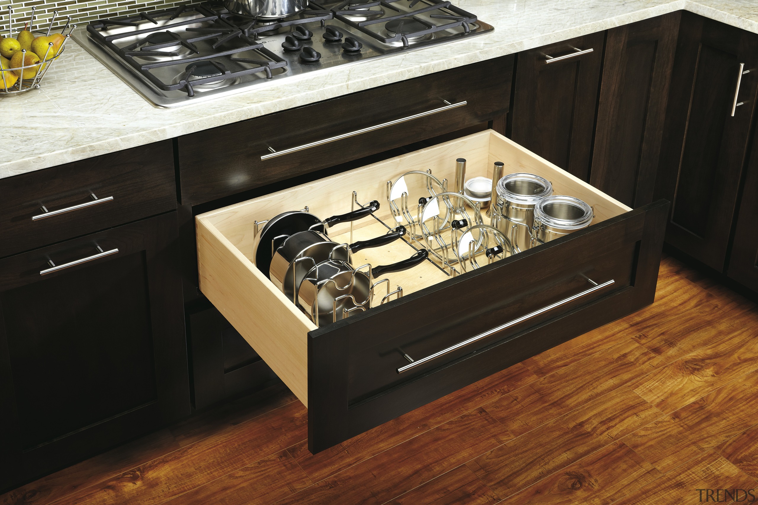 View of kitchen organisation products by Rev-A-Shelf, including countertop, drawer, furniture, gas stove, home appliance, kitchen, kitchen appliance, kitchen stove, table, black