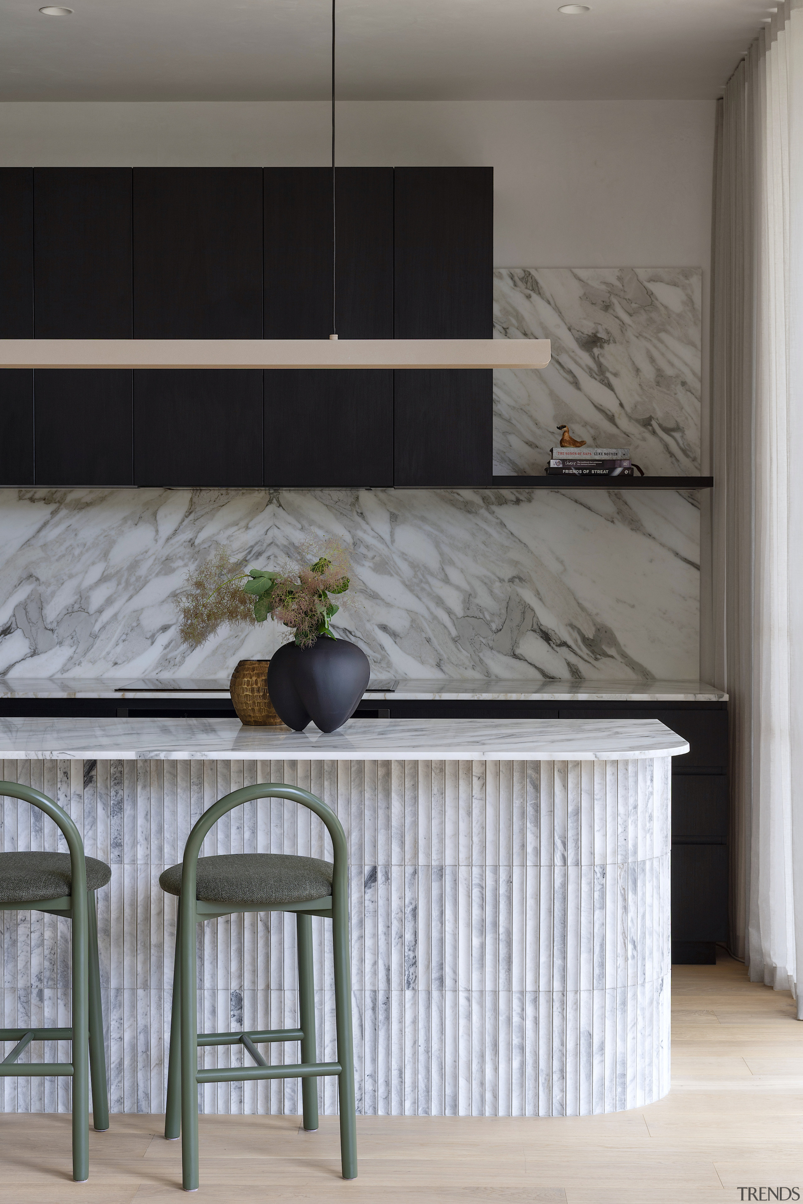 Feature island and splashback in Calacatta marble have 