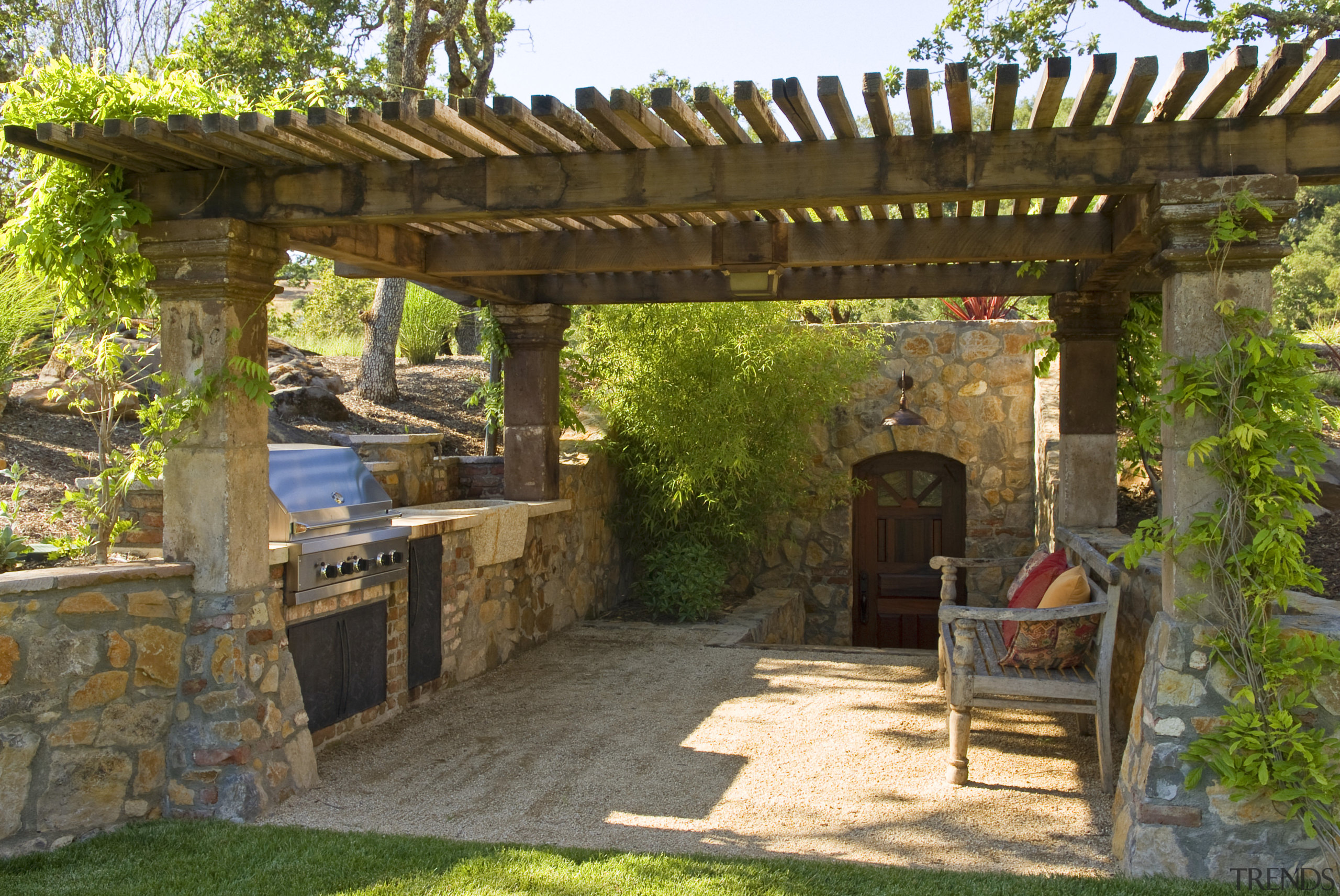 View of the BBQ patio, which features stonework backyard, courtyard, landscape, outdoor structure, patio, pergola, yard, brown