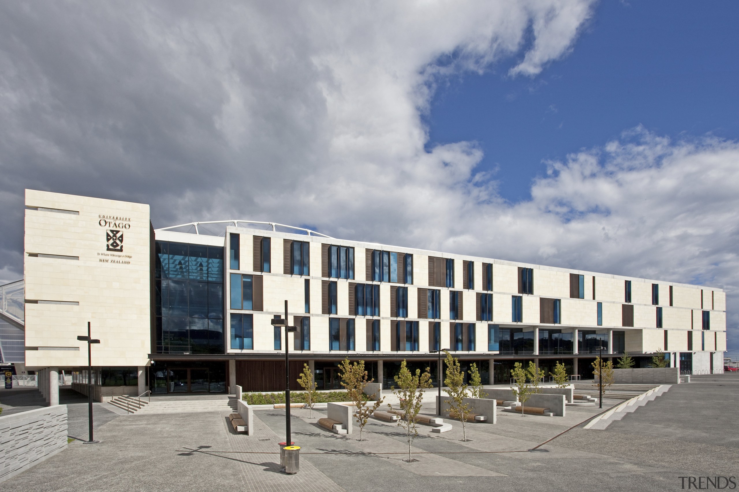 Exterior with white and glass wall. - Exterior architecture, building, commercial building, corporate headquarters, facade, mixed use, sky, gray