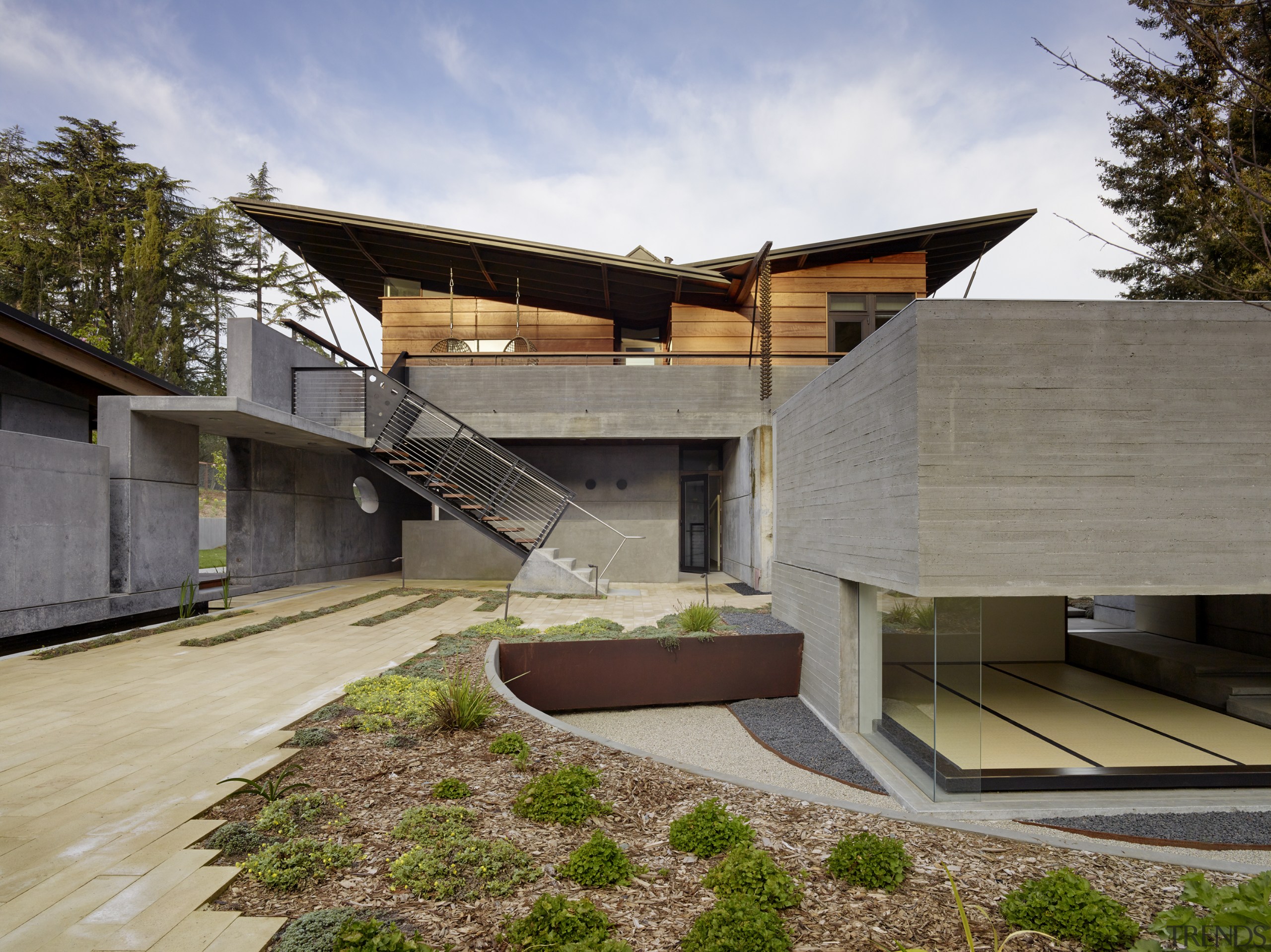 ​​​​​​​The butterfly roof design on this home conceals architecture, , home, house, residential, cladding, concrete, redwood, FuTung Cheng, Cheng Design