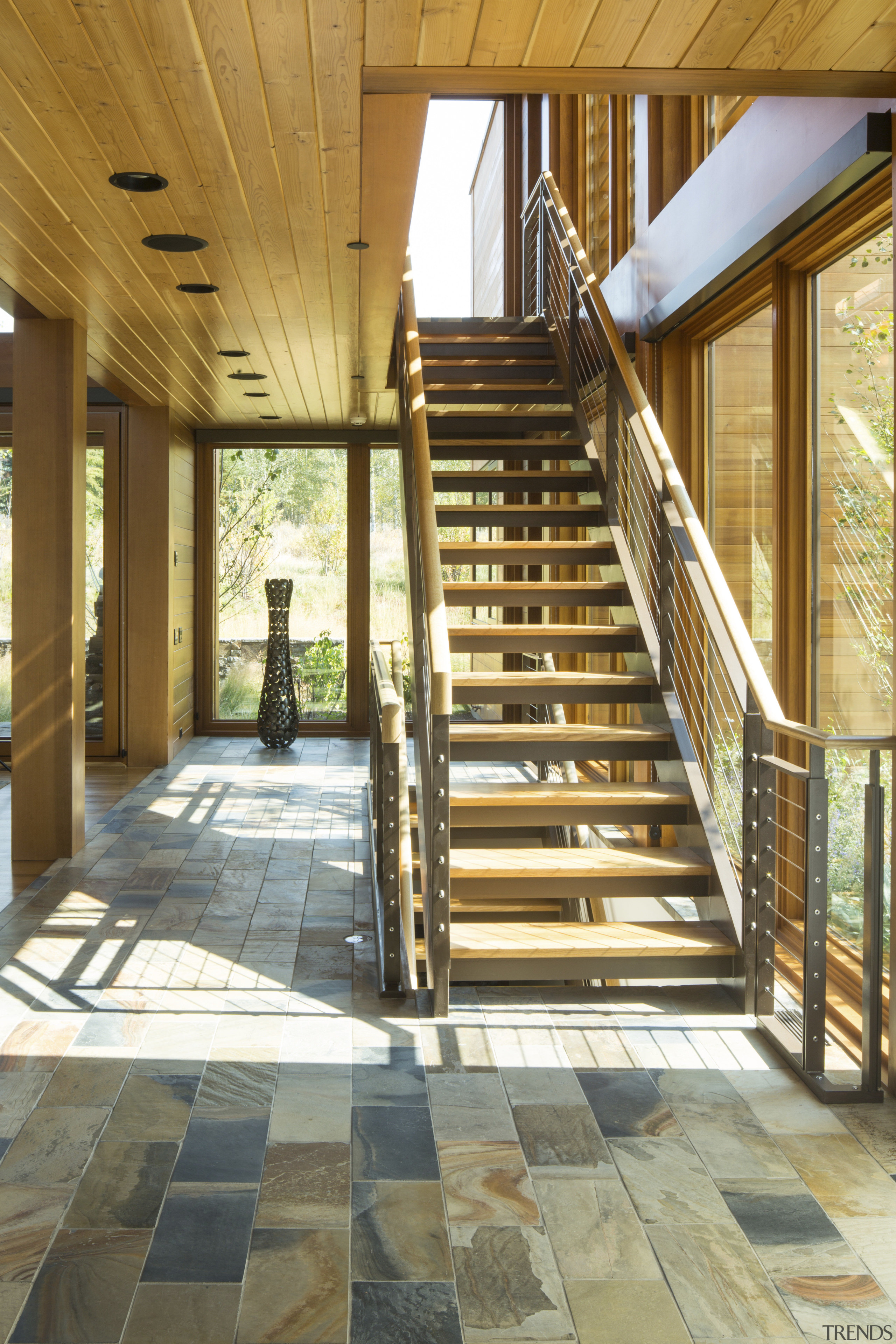 These stairs in a post-and-beam vacation home lead architecture, daylighting, deck, floor, flooring, handrail, home, house, porch, real estate, stairs, wood, brown