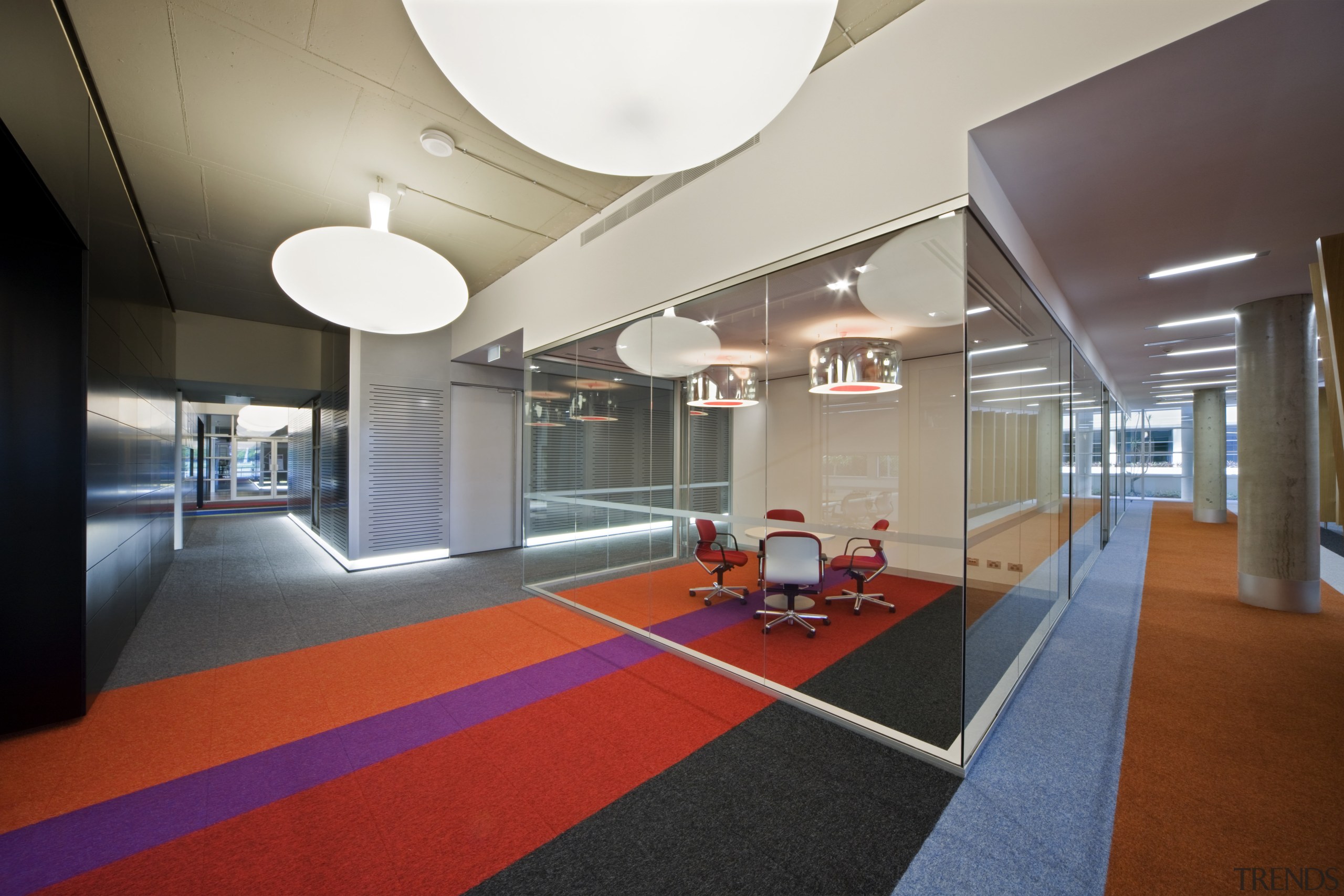 Innovative lighting and colourful striped carpet tiles are architecture, ceiling, floor, flooring, interior design, leisure centre, lobby, real estate, structure, gray