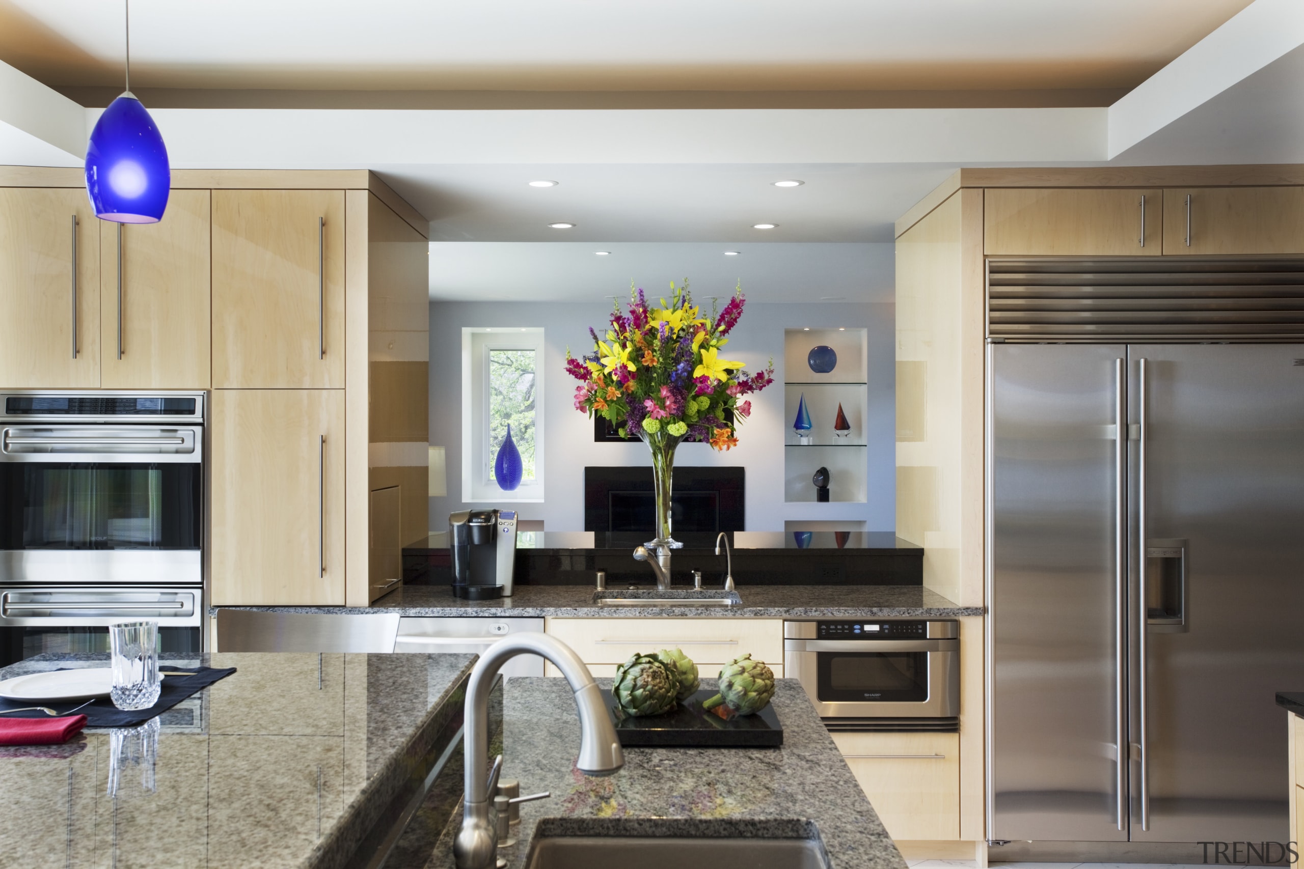 A raised granite breakfast bar screens countertop clutter ceiling, countertop, interior design, kitchen, living room, room, gray