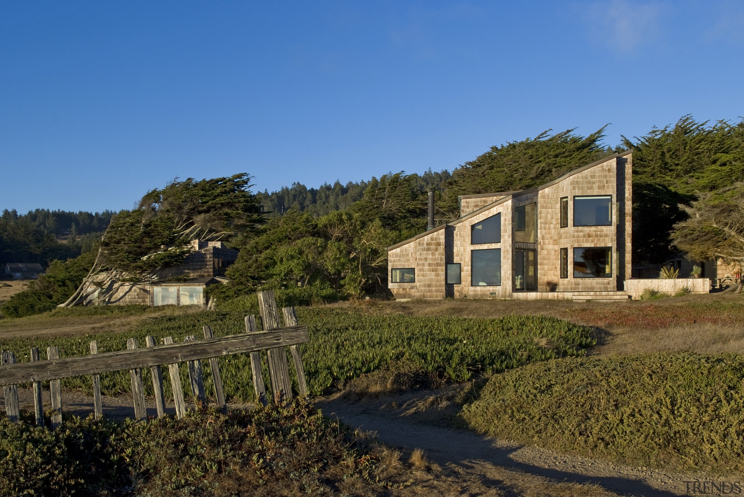 The new exterior is true to the original architecture, cottage, estate, facade, farmhouse, home, house, landscape, property, real estate, reflection, rural area, sky, tree, villa, brown, teal