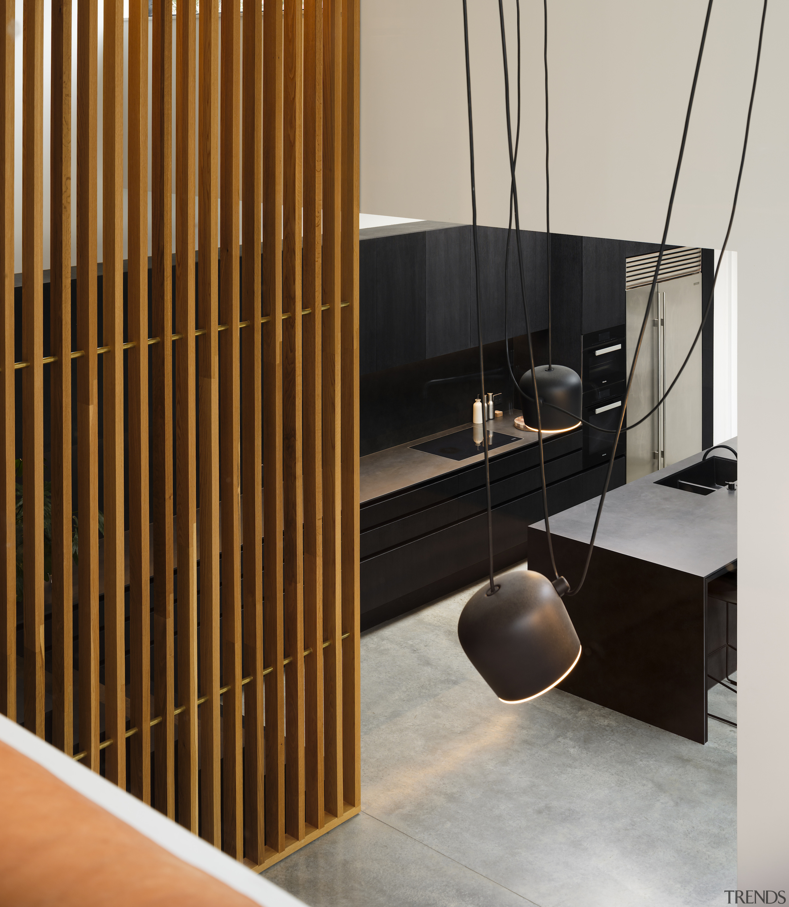 The kitchen's monolithic and minimalist look is punctuated 