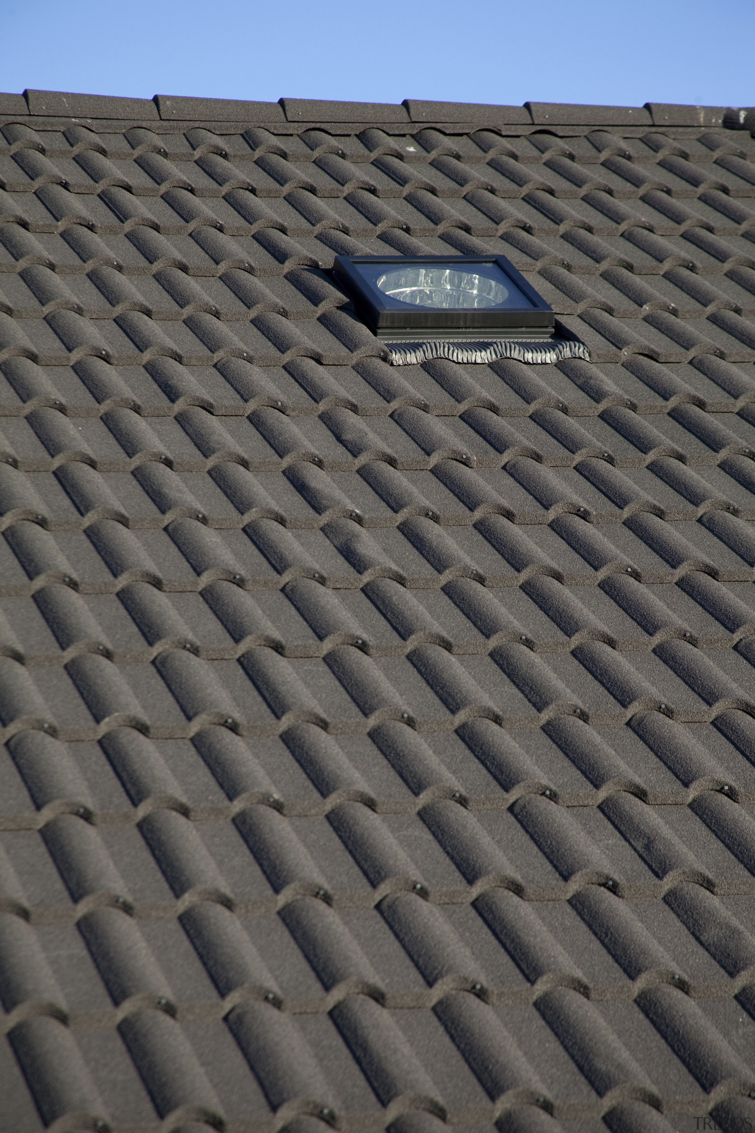 Exterior view of a David Reid Homes show daylighting, line, outdoor structure, roof, sky, soil, gray, black