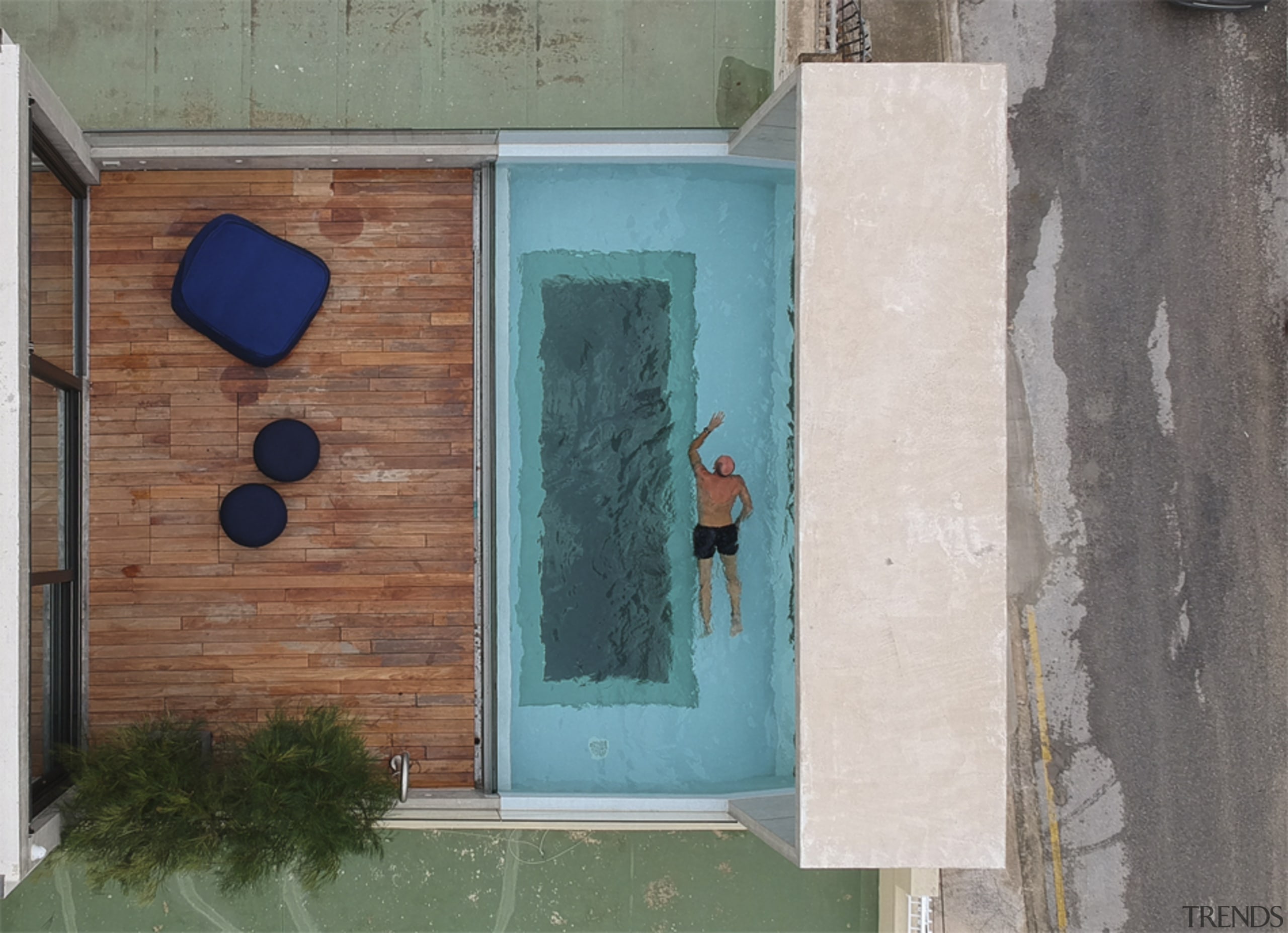 A bird's eye view of Casa B's top-level blue, door, green, turquoise, wall, window, wood, gray, landscaping, rooftop pool