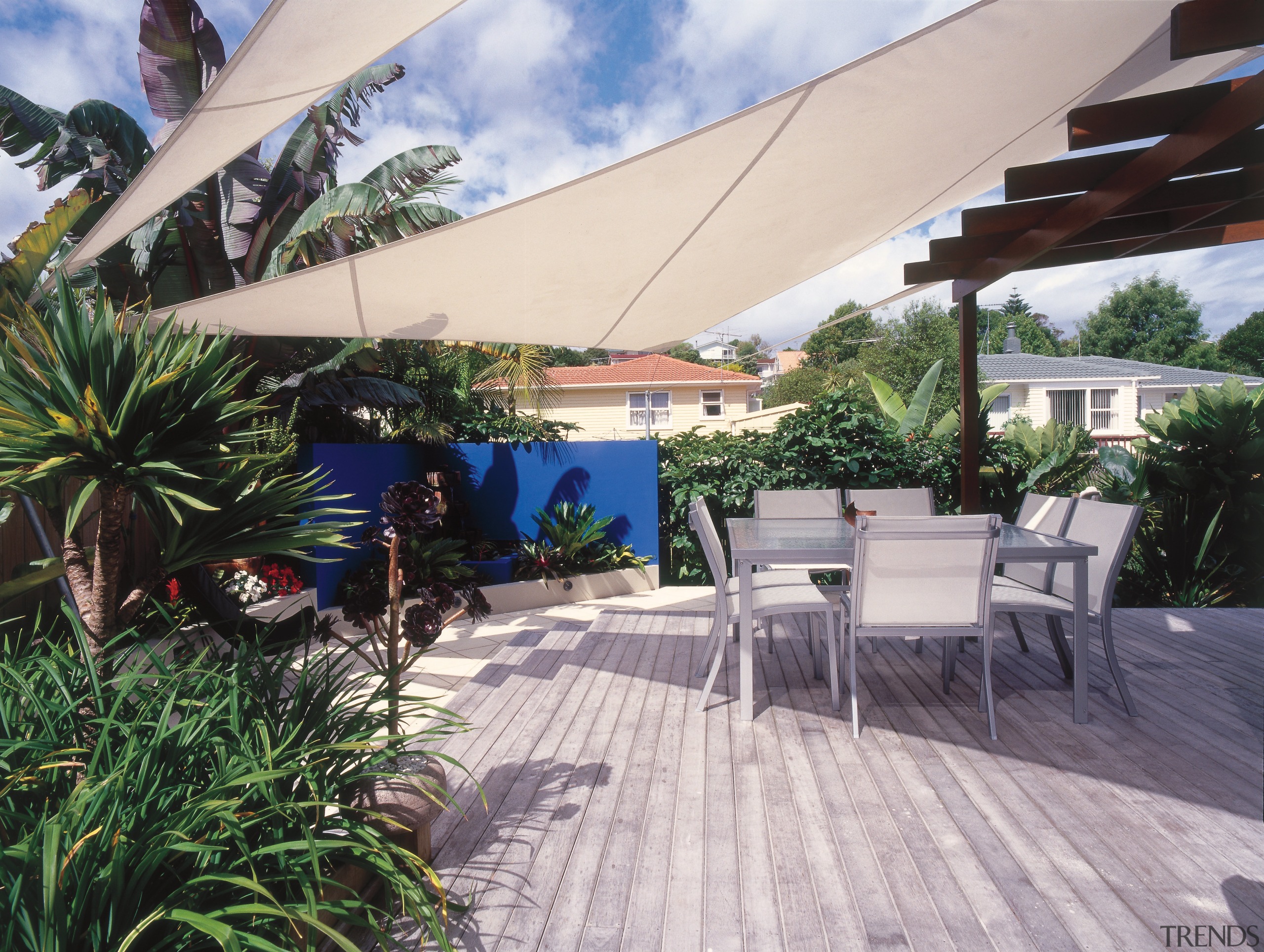 An exterior view of the patio and garden arecales, canopy, outdoor structure, palm tree, patio, property, real estate, resort, roof, shade, gray