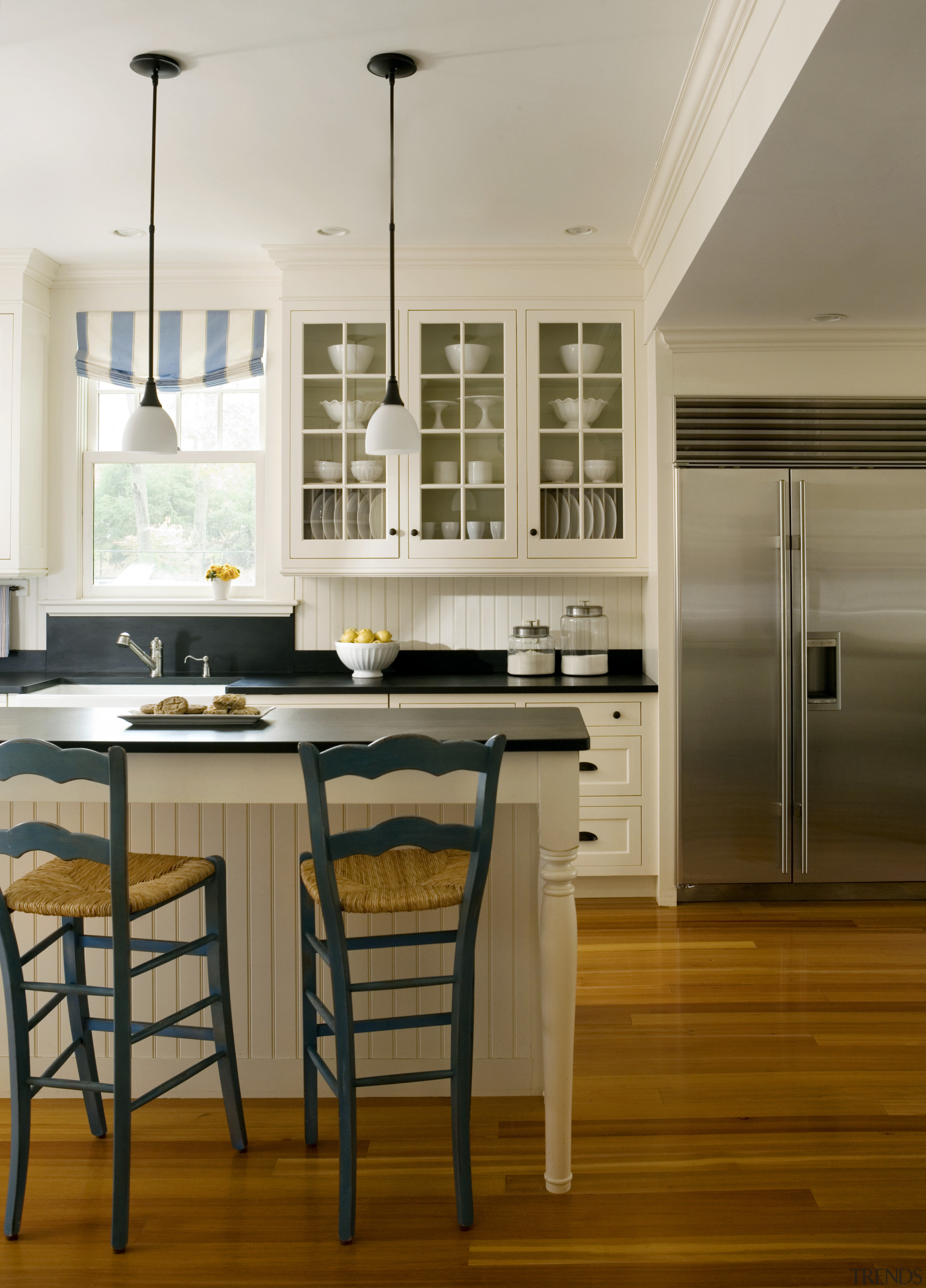 View of kitchen with light-toned cabinets and dark-toned cabinetry, ceiling, countertop, cuisine classique, dining room, floor, flooring, hardwood, home, interior design, kitchen, laminate flooring, room, wood flooring, brown, gray