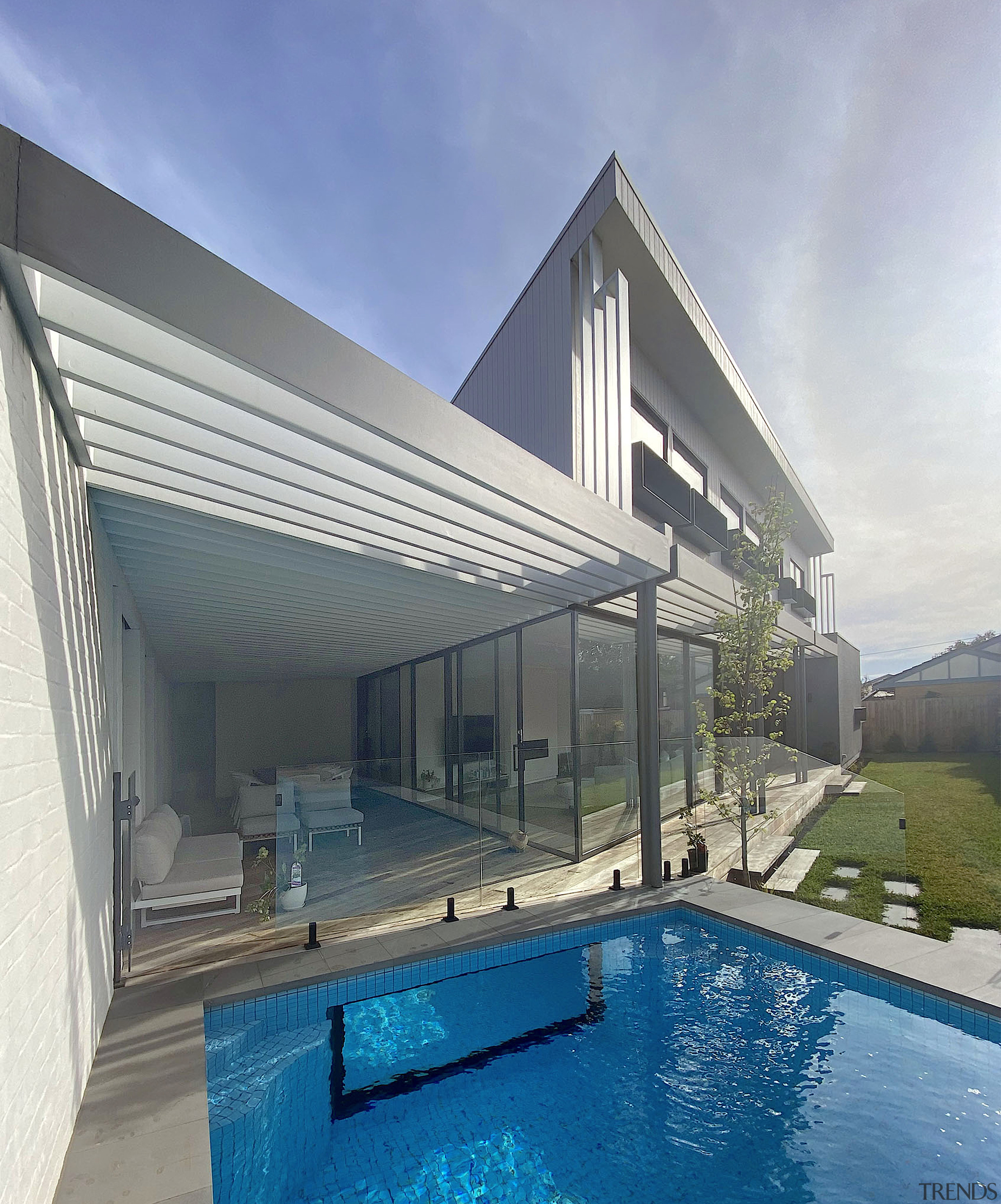 The pool and indoor-outdoor flow from the rear 