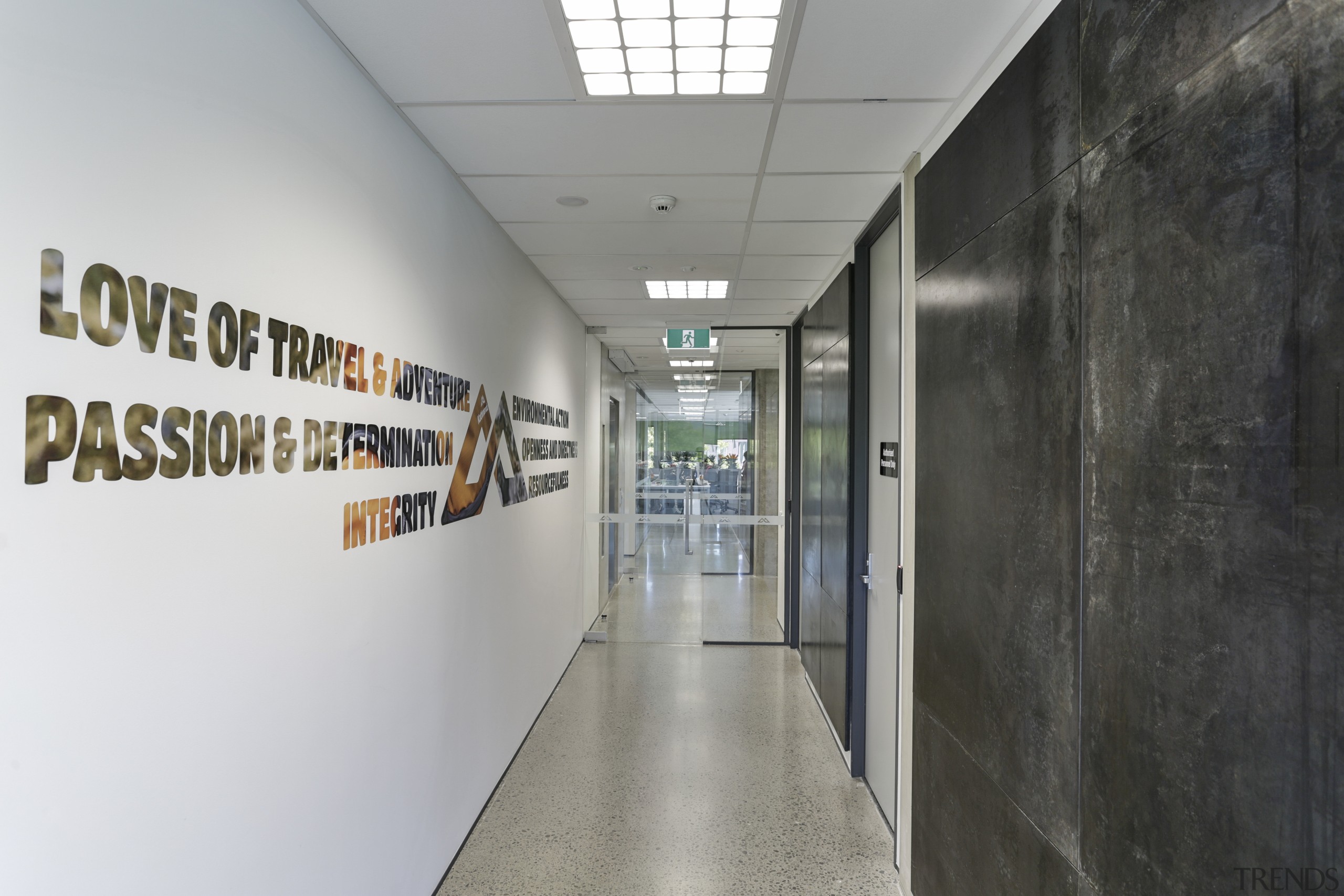 Waxed steel walls and empowering slogans feature in gray, black