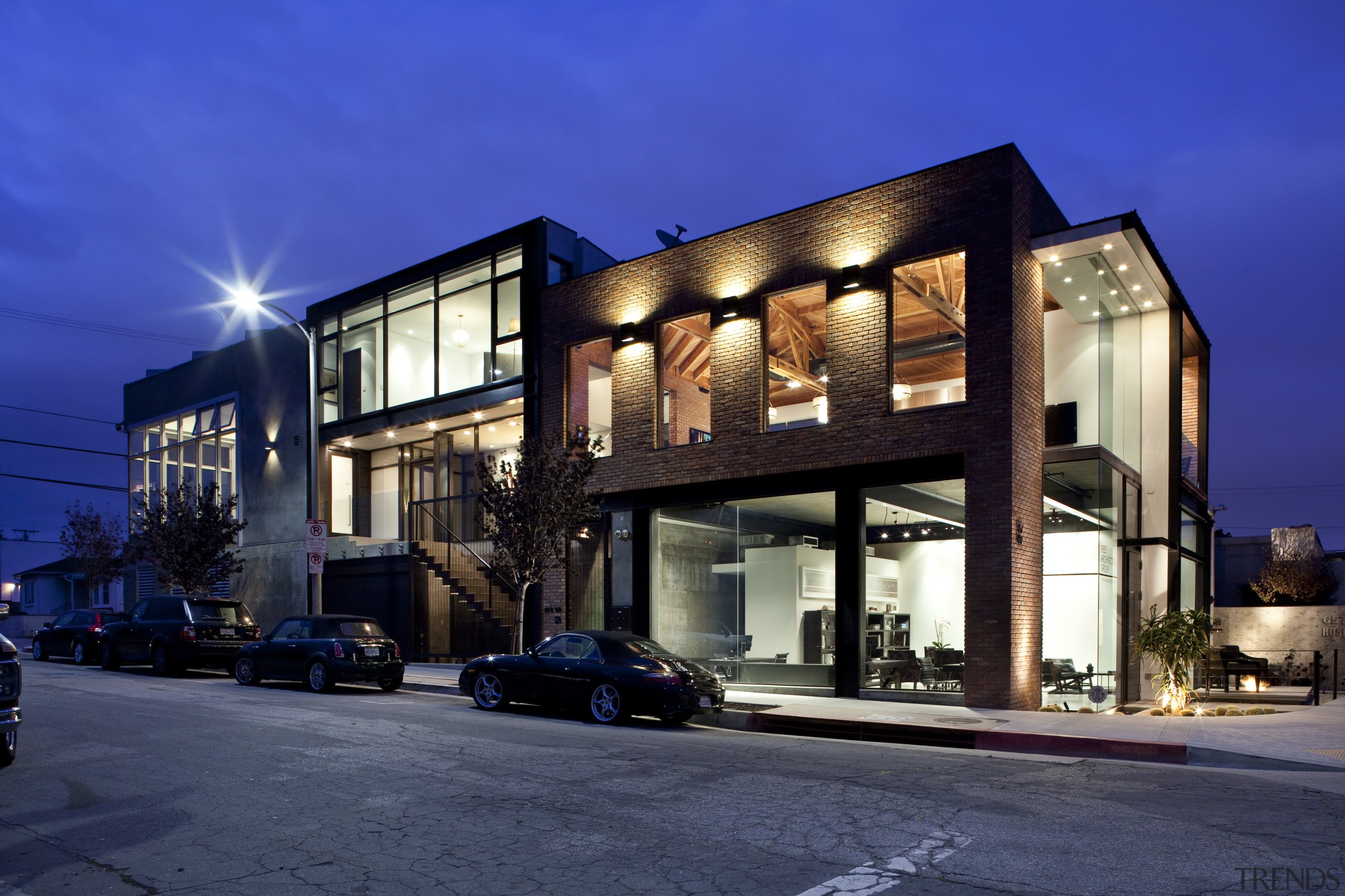 Exterior night shot of contemporary building. - Exterior apartment, architecture, building, commercial building, condominium, evening, facade, home, house, mixed use, neighbourhood, property, real estate, residential area, sky, window, blue