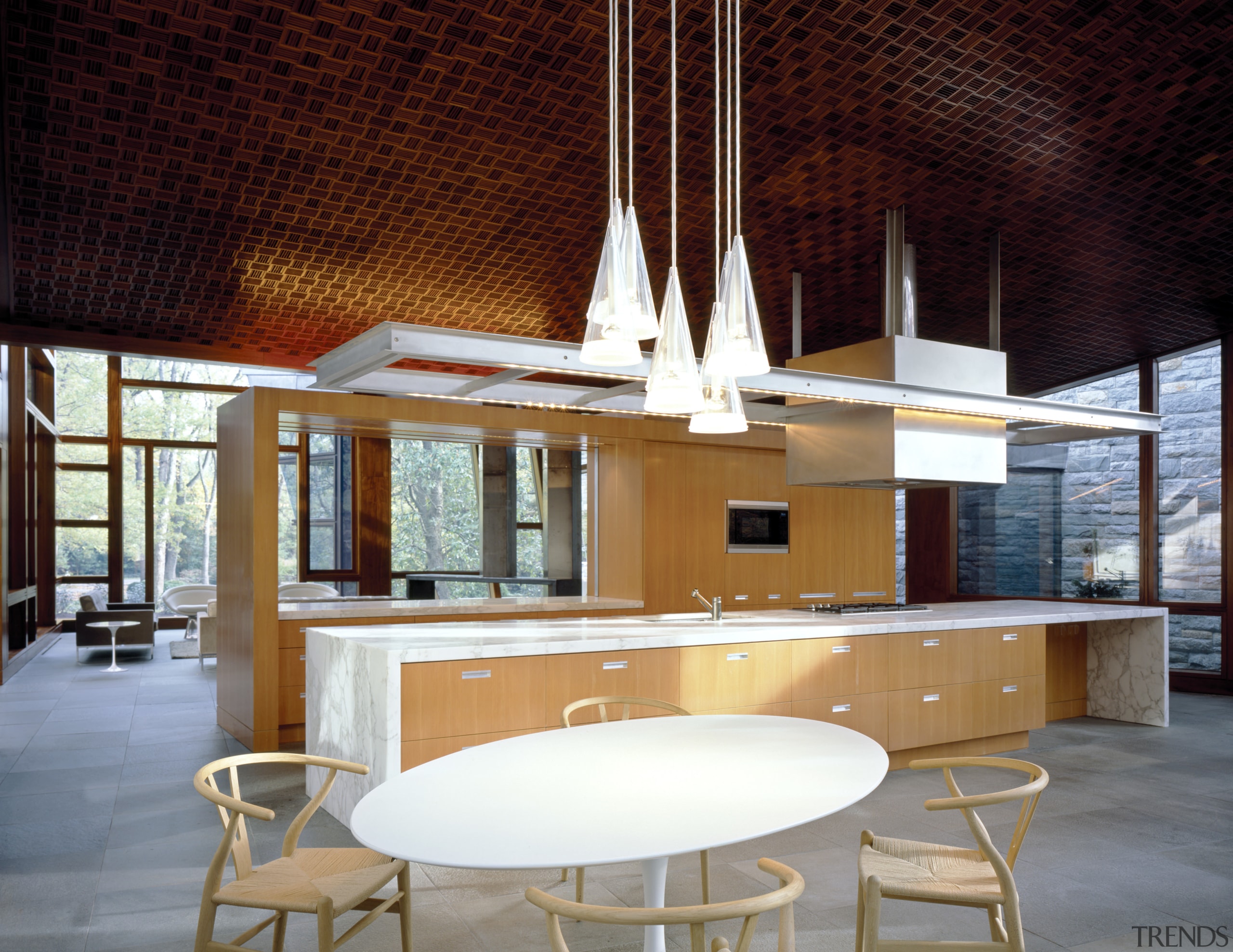 With its lineal, stand-alone bank of cabinetry and architecture, ceiling, chair, furniture, interior design, table, red