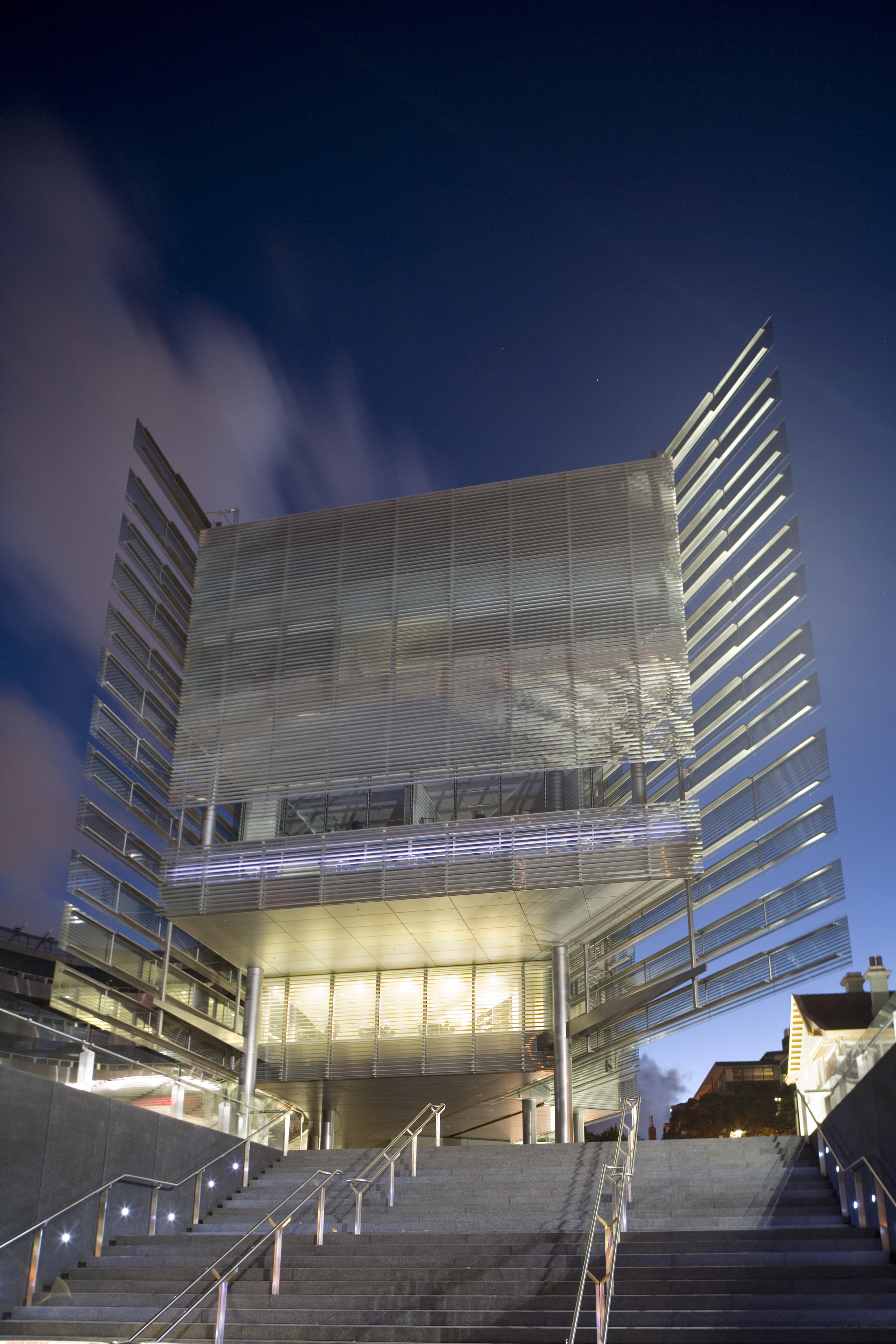 View of the exterior of the Owen G architecture, building, city, commercial building, convention center, corporate headquarters, daylighting, daytime, facade, headquarters, landmark, metropolis, metropolitan area, mixed use, night, sky, skyscraper, structure, tower block, urban area, blue, gray