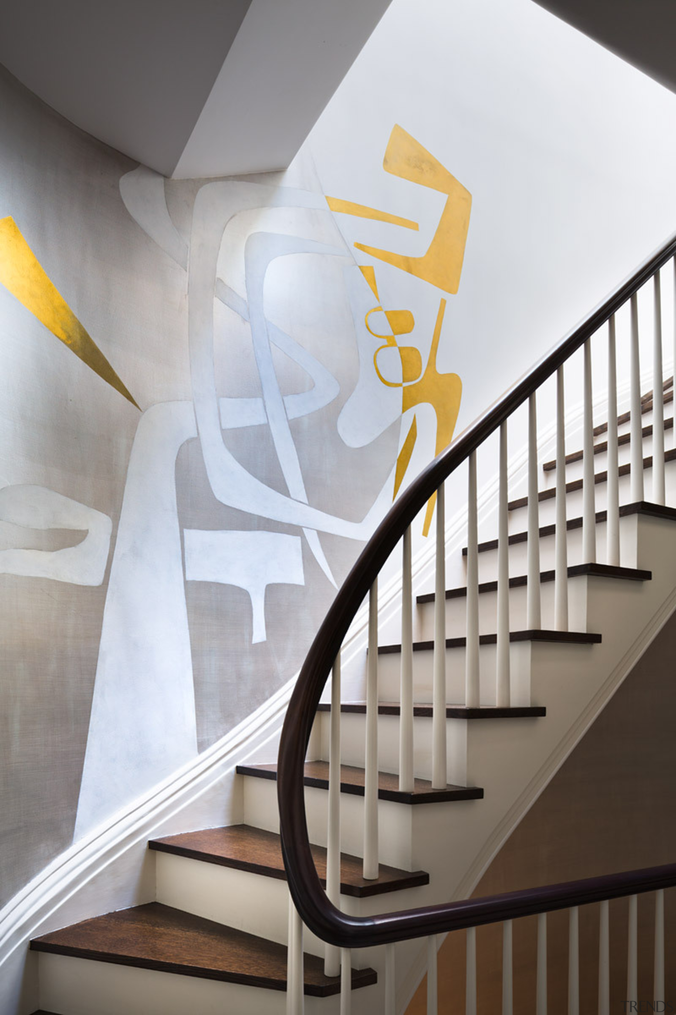 A sculptural staircase runs through the 1874 four-storey architecture, baluster, ceiling, daylighting, handrail, interior design, stairs, white, gray