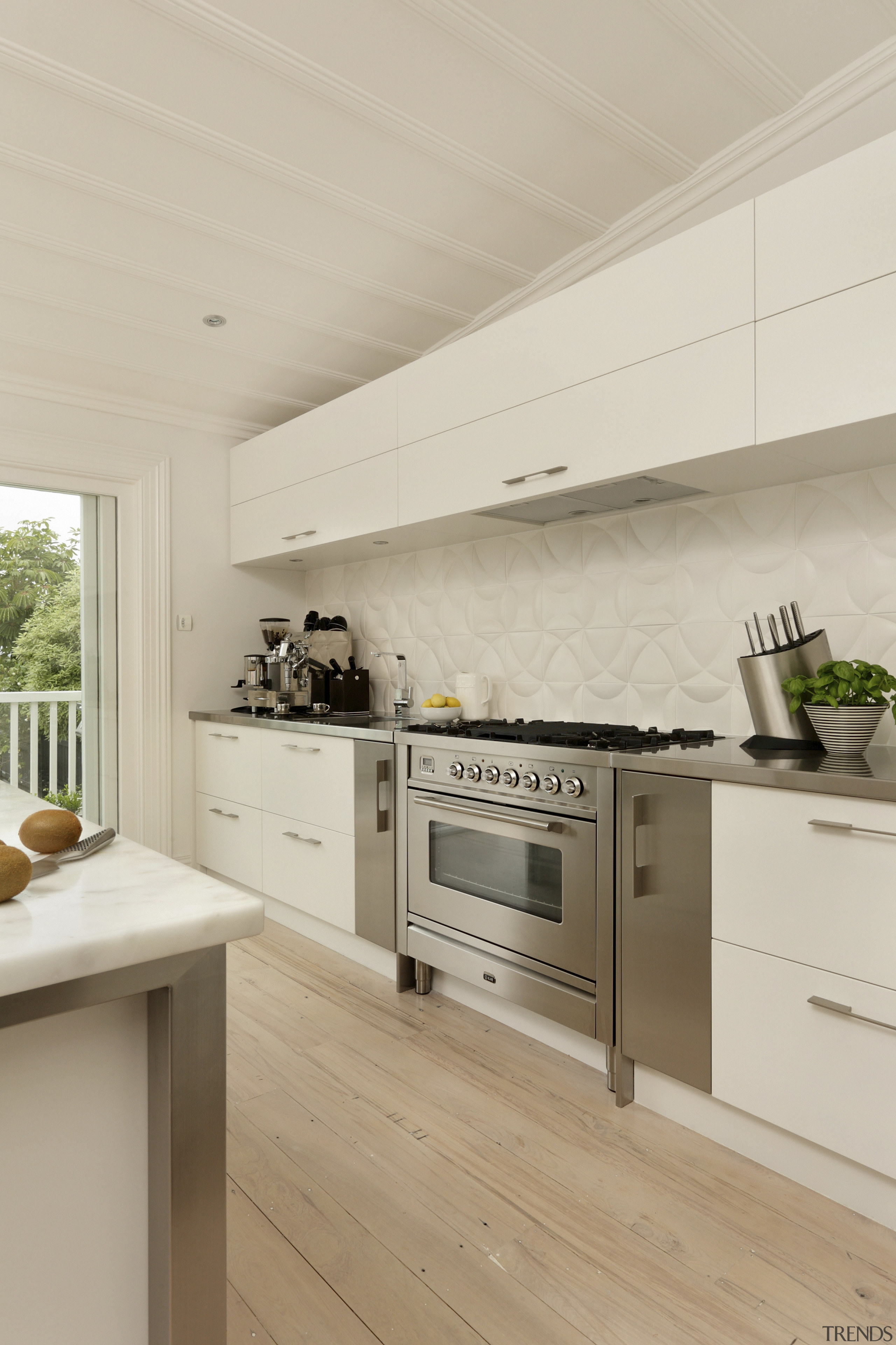 View of contemporary kitchen with light-toned flooring, ceiling countertop, cuisine classique, floor, flooring, home, interior design, kitchen, laminate flooring, real estate, wood flooring, gray