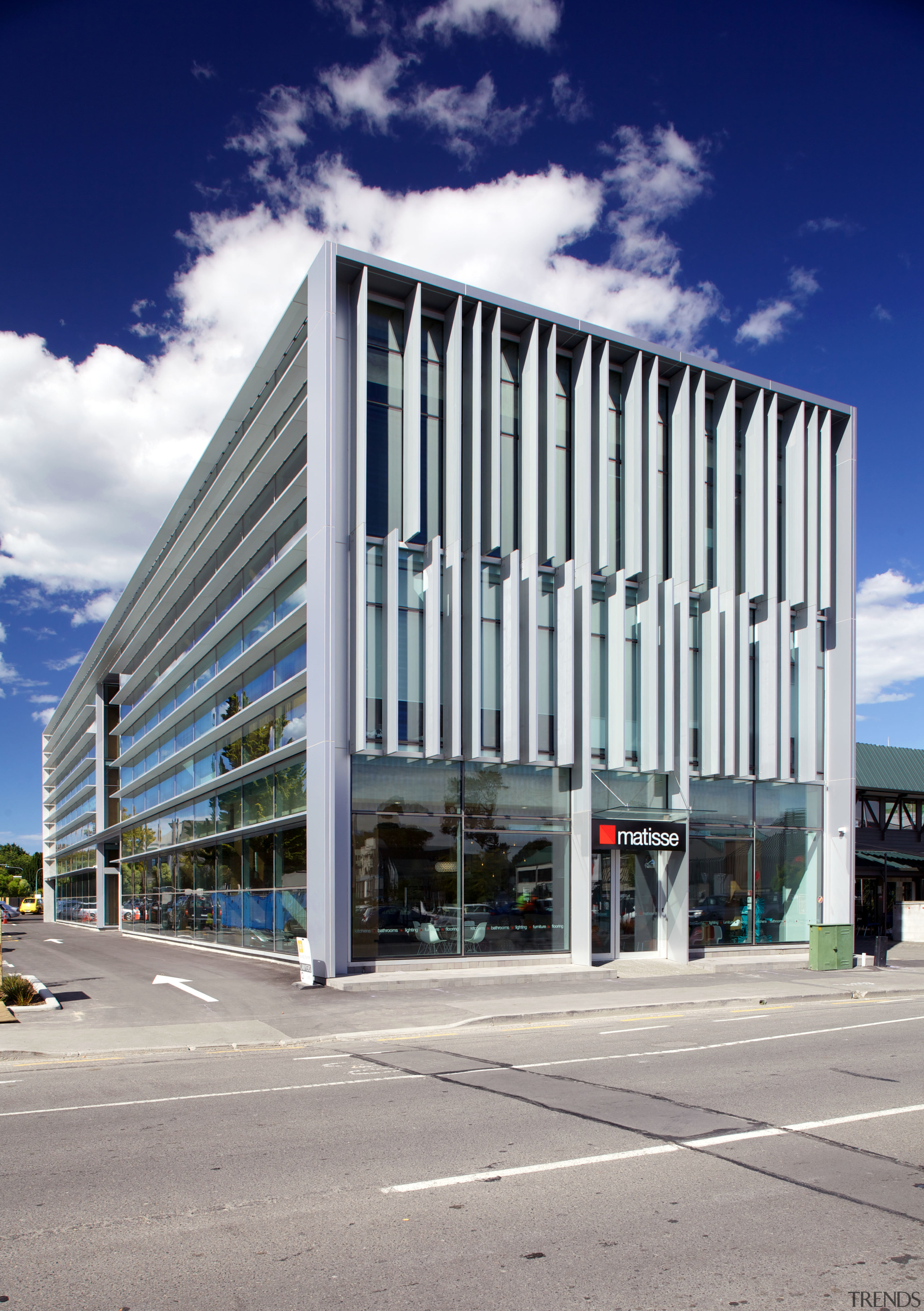 Large louvres and fins shield the new Young architecture, building, commercial building, condominium, corporate headquarters, daytime, facade, headquarters, metropolis, metropolitan area, mixed use, real estate, sky, structure, gray