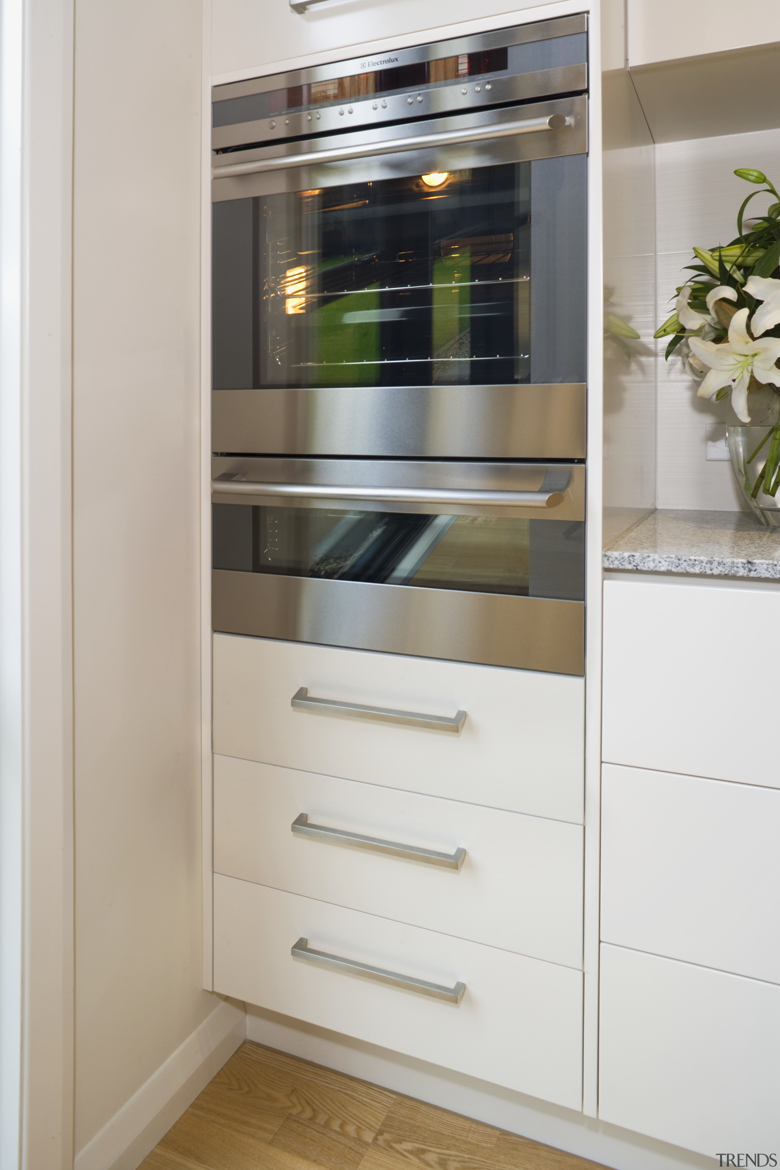 The Duo oven boasts spacious, flexible interiors. - bathroom accessory, cabinetry, chest of drawers, closet, cupboard, display case, drawer, furniture, home appliance, kitchen, refrigerator, room, shelf, shelving, gray