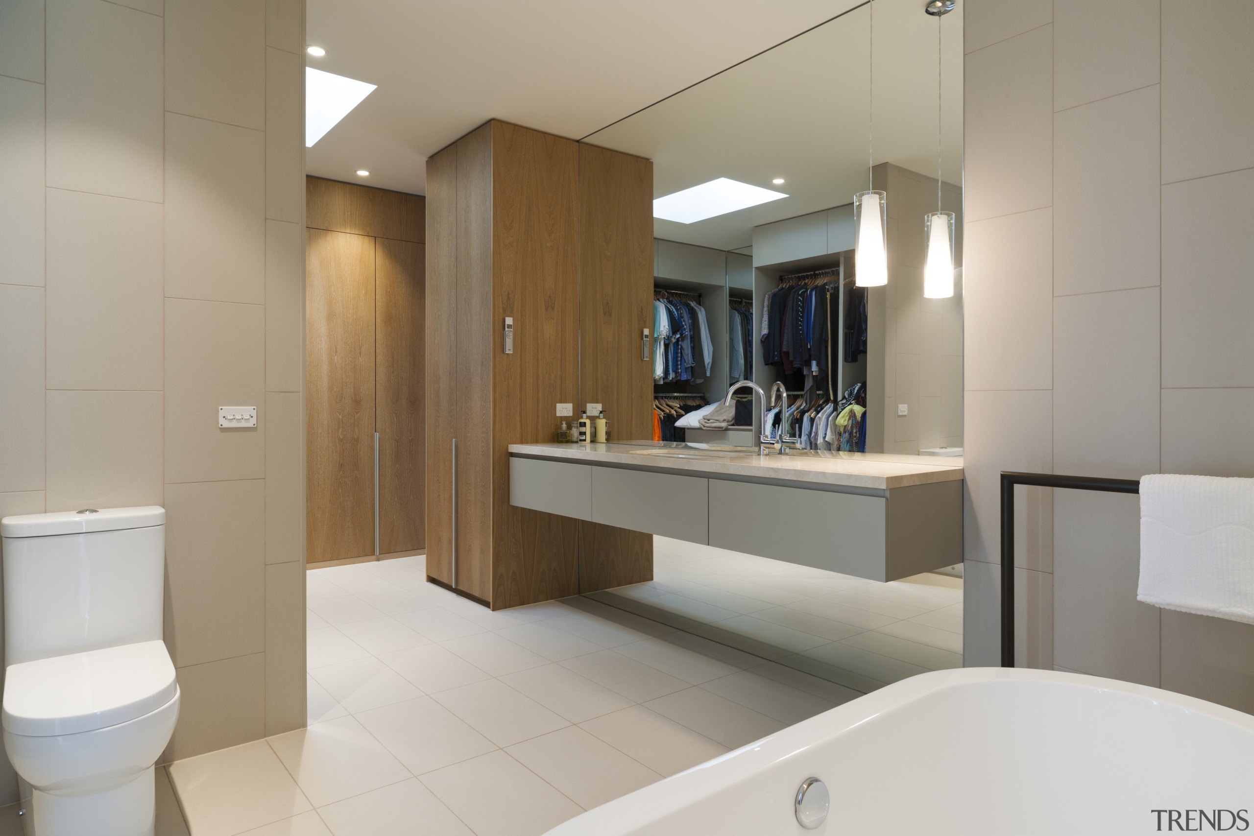 Seen in reflection, the dressing area is in bathroom, floor, interior design, product design, room, sink, gray