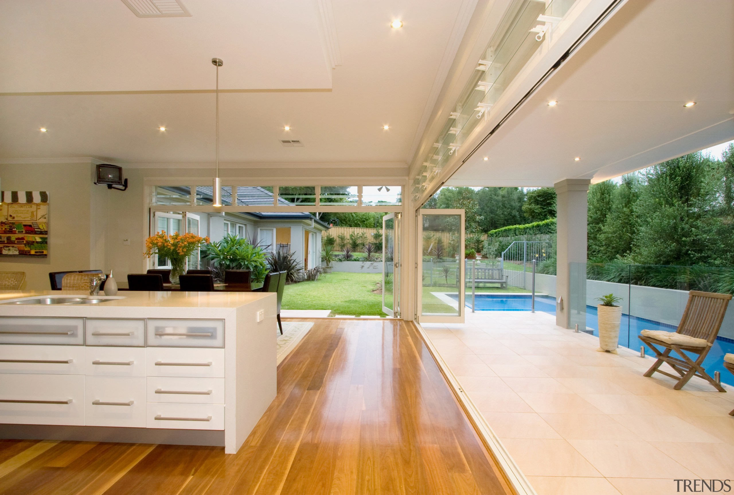 View of the kitchen and dining area in ceiling, estate, floor, flooring, hardwood, house, interior design, kitchen, real estate, orange, white