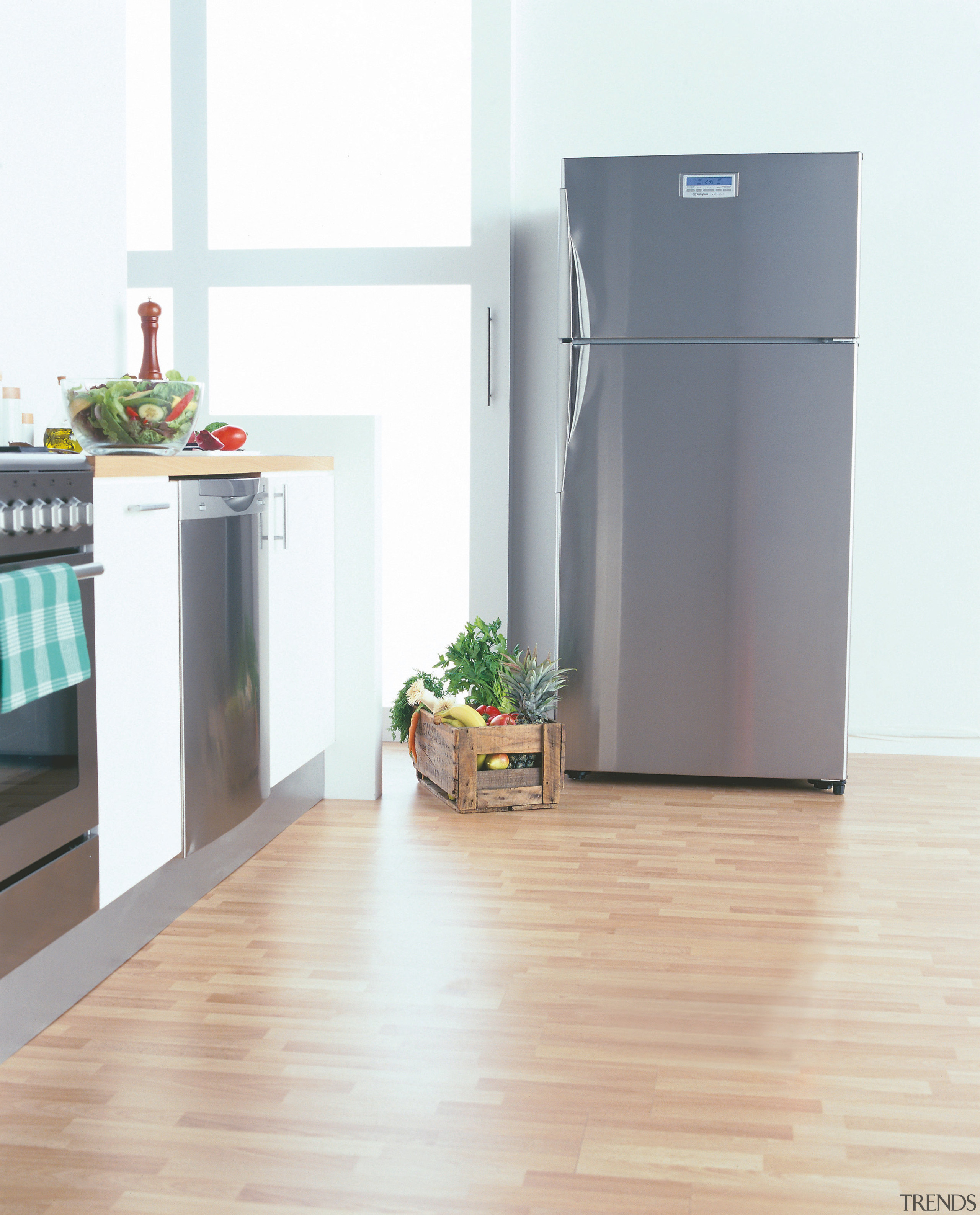 A kitchen featuring a large Westinghouse refrigerator. The floor, flooring, hardwood, home appliance, kitchen appliance, major appliance, product, refrigerator, white