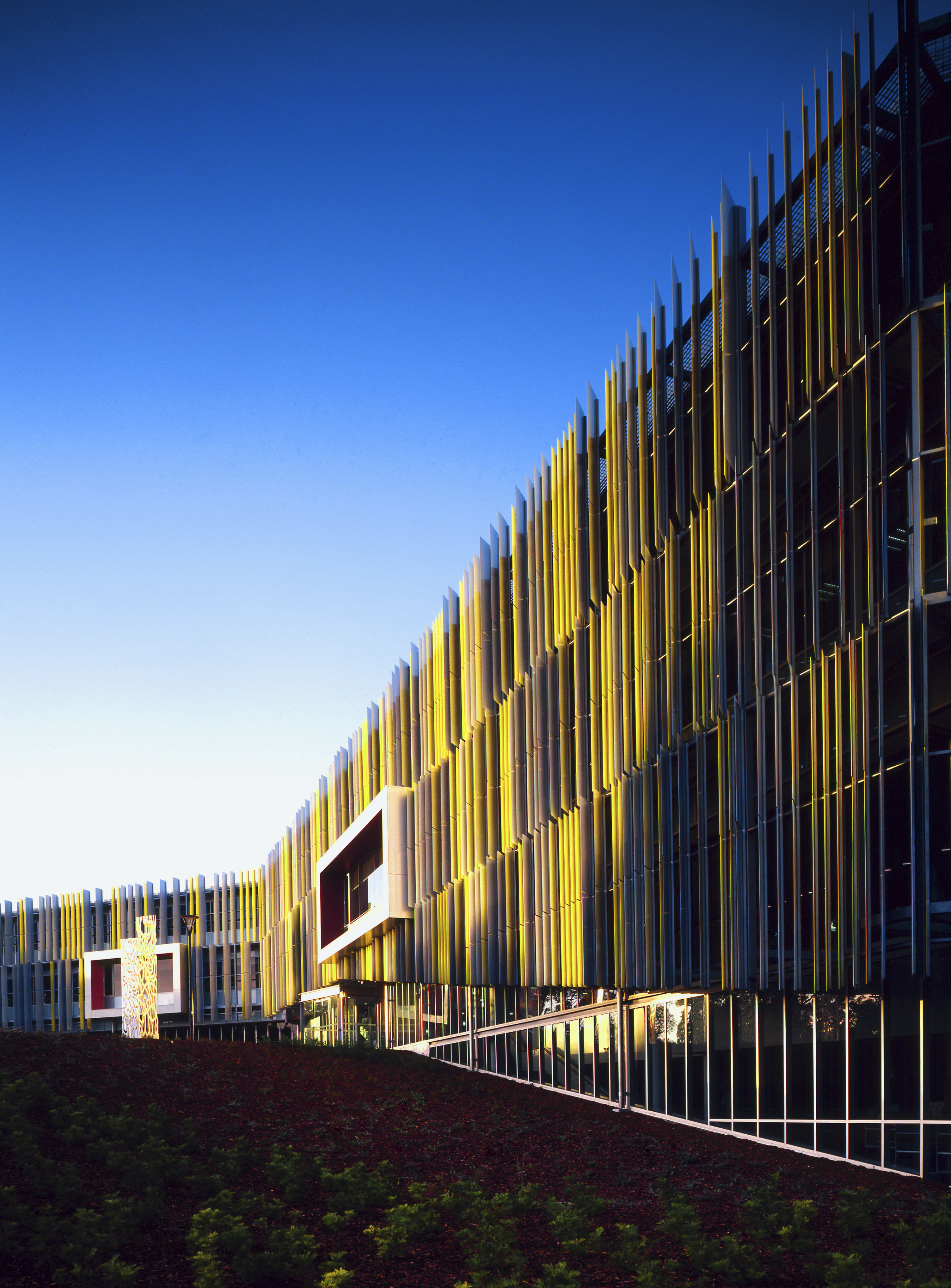 The coloured fins on the new library building architecture, building, commercial building, corporate headquarters, daytime, evening, facade, headquarters, house, landmark, metropolis, metropolitan area, mixed use, reflection, residential area, sky, structure, sunlight, urban area, black, blue