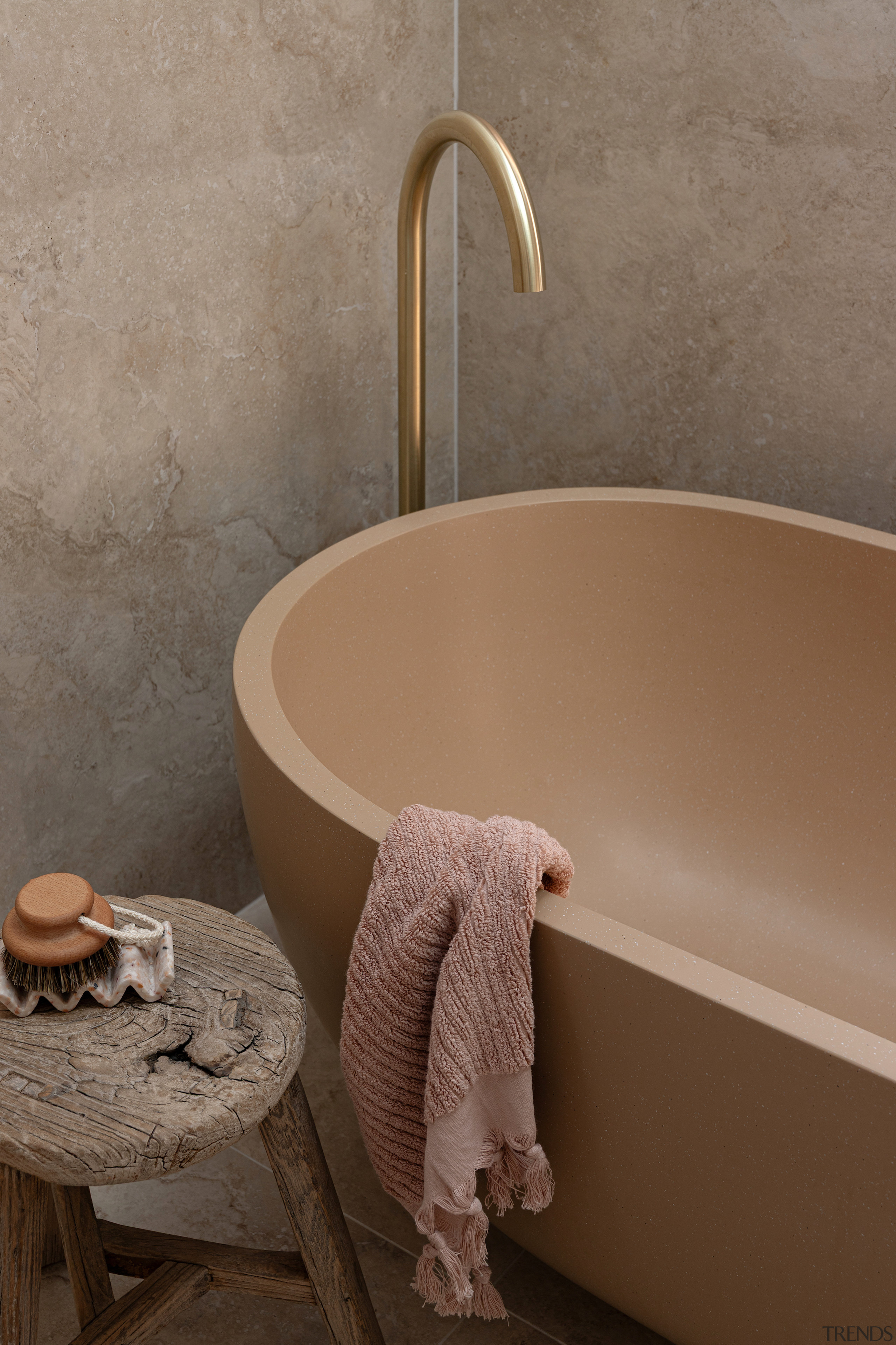 Bath and floor-mounted pourer are features of the 