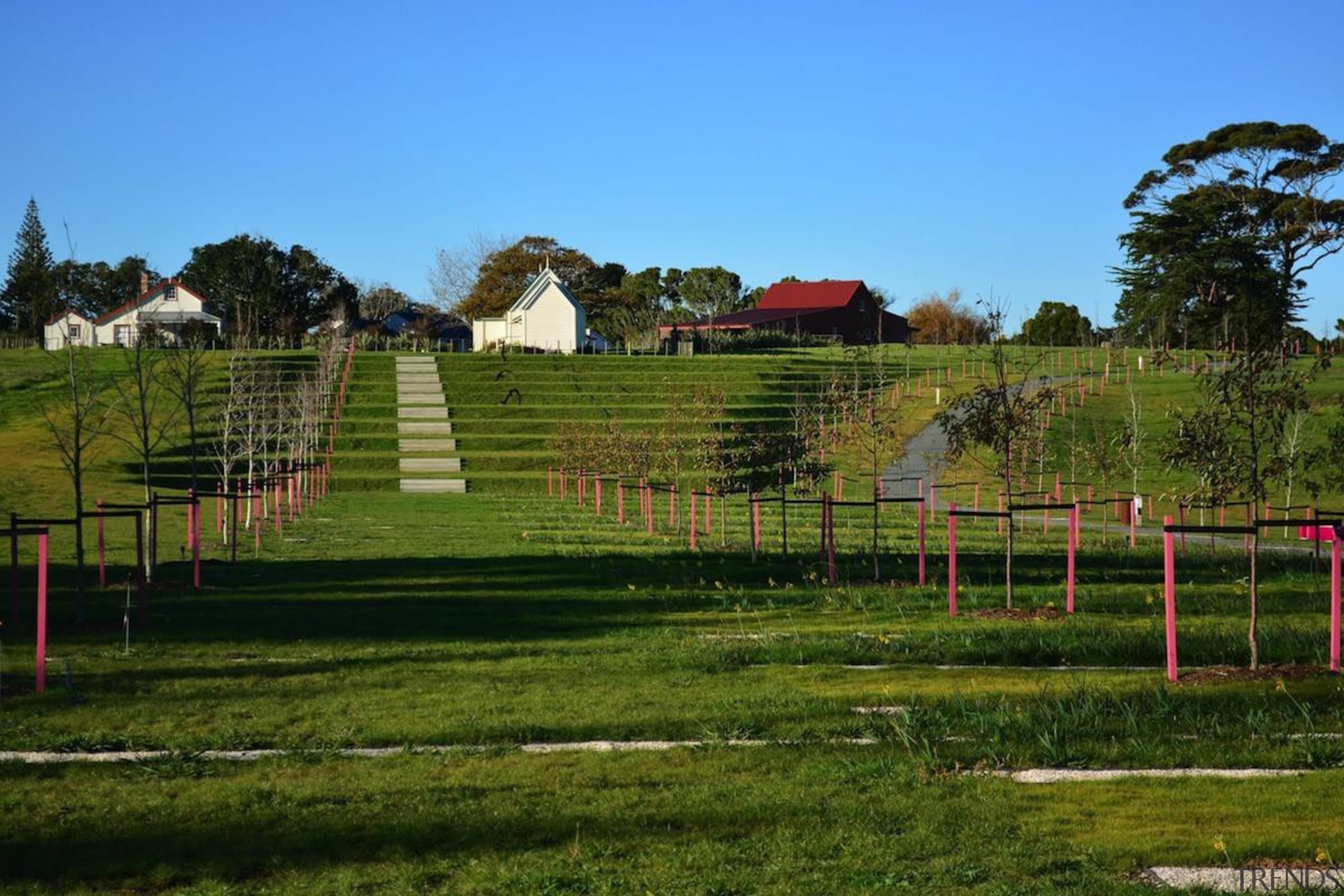 LANDSCAPE AWARD  Pops of pink surprise and estate, farm, fence, field, grass, grassland, house, land lot, landscape, lawn, meadow, outdoor structure, pasture, rural area, sky, tree, brown, teal