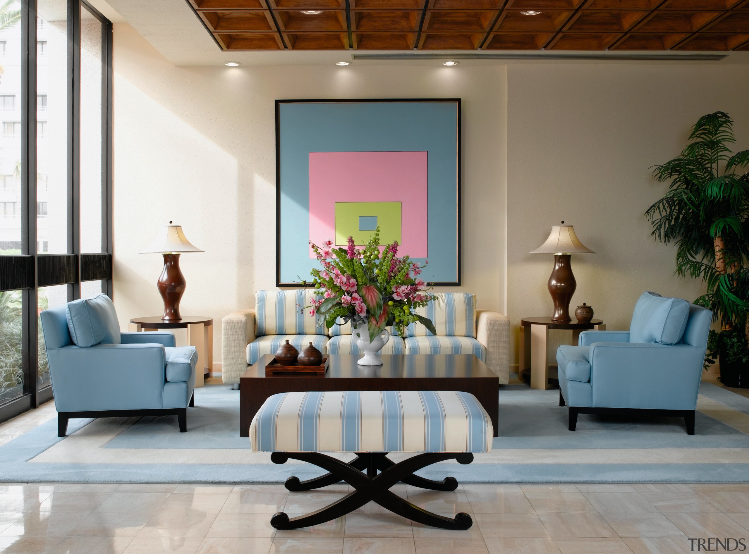 view of sthe lobby featuring pale blue furniture ceiling, furniture, interior design, living room, lobby, room, table, wall, gray