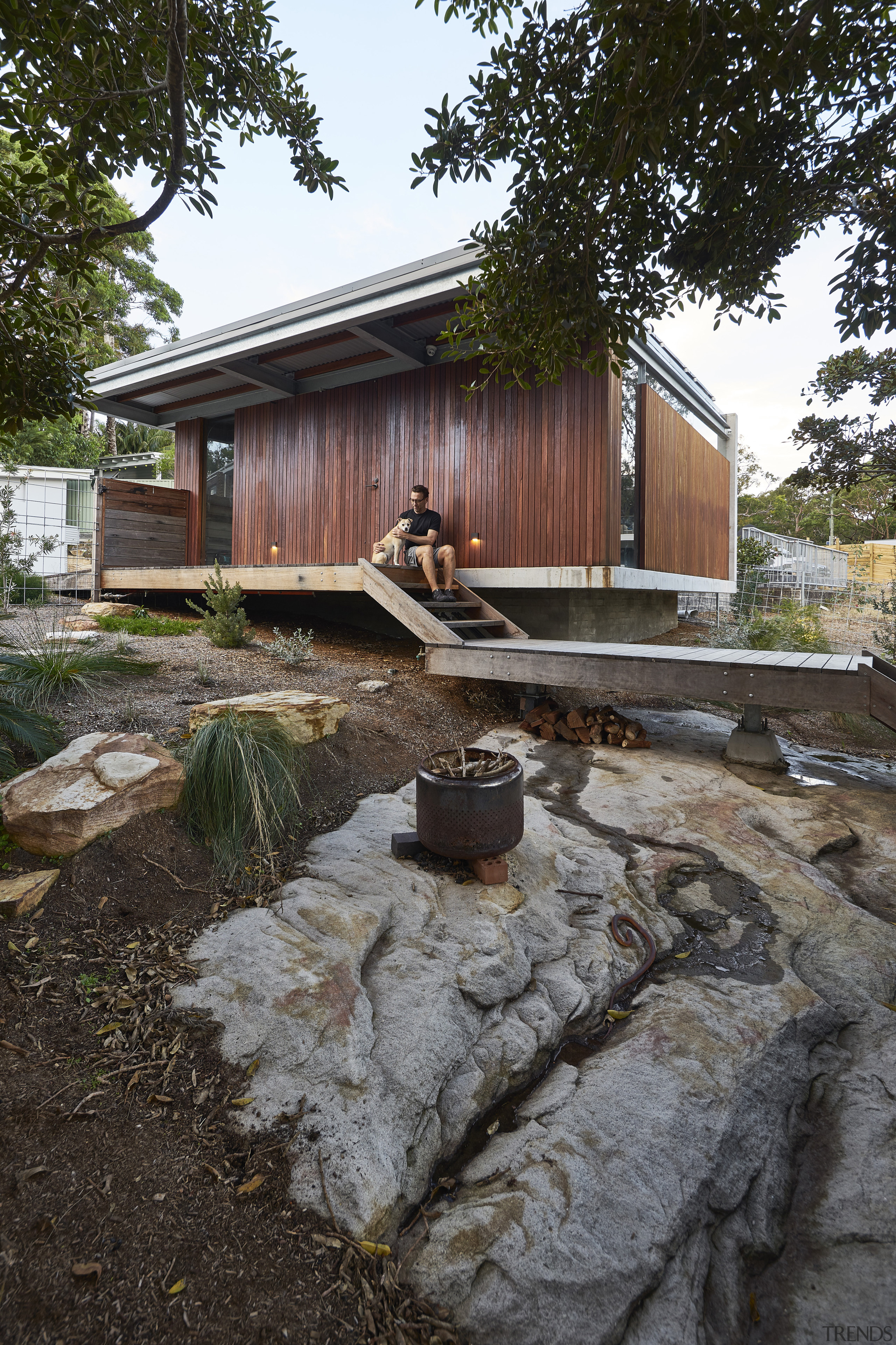 Set above,  the garage echoes the simple materials 