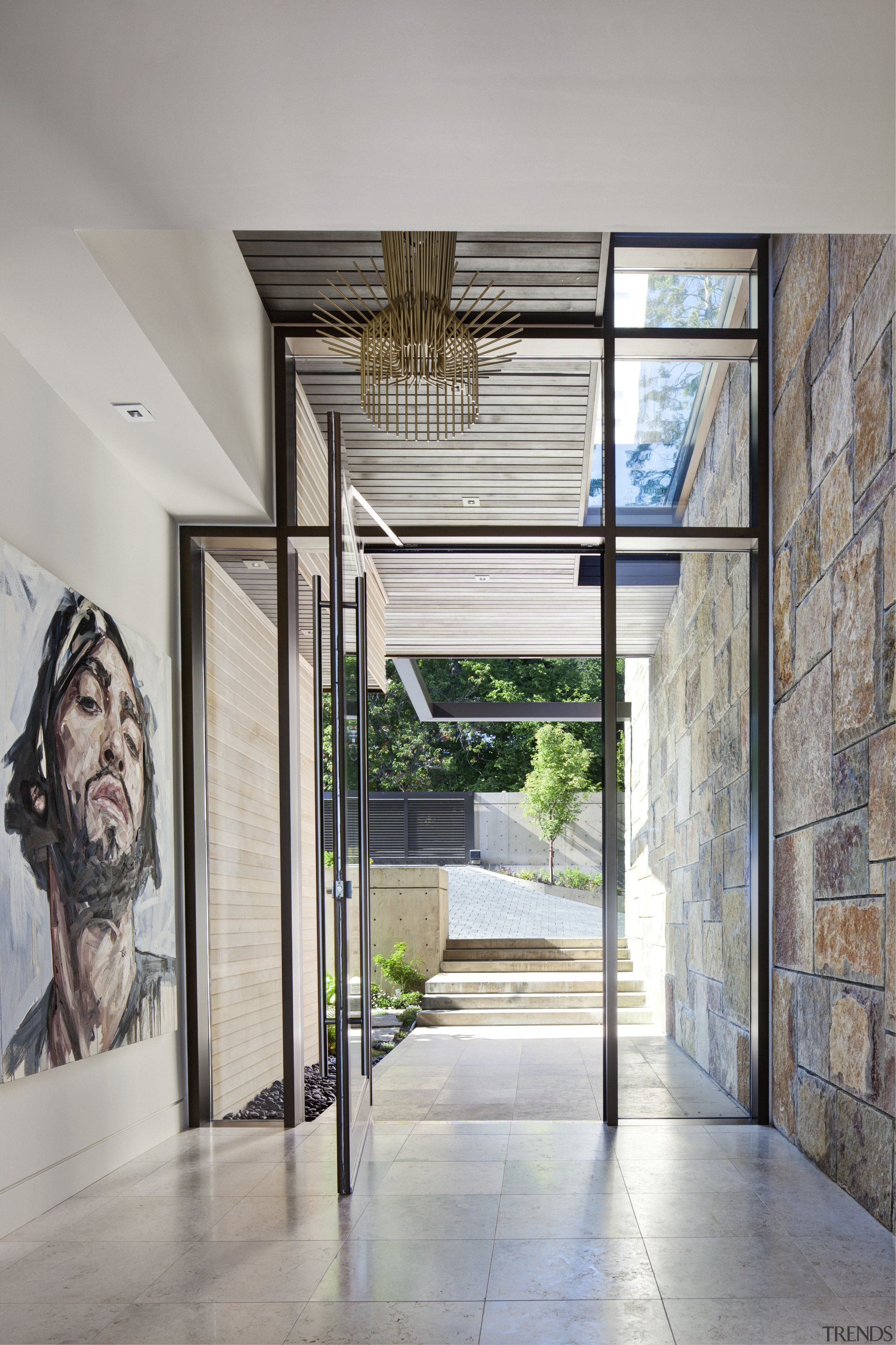 This is a home that was designed by architecture, door, glass, house, interior design, lobby, window, gray