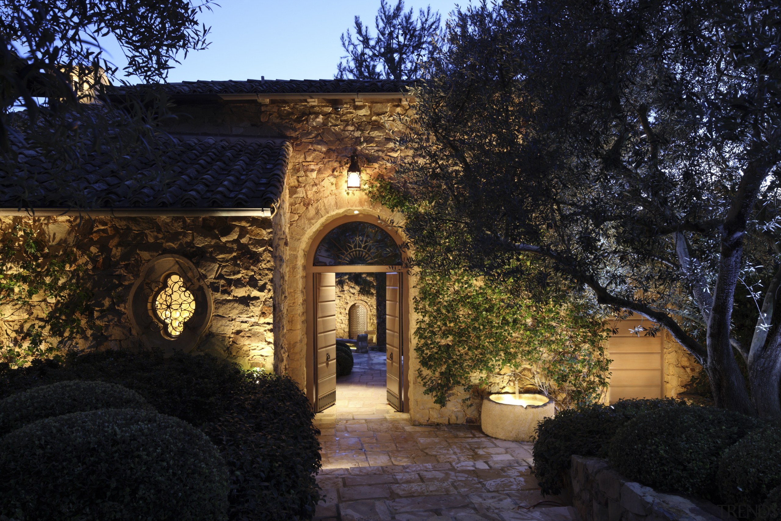 Exterior view of entrance way. - Exterior view architecture, estate, evening, hacienda, home, house, landscape, landscape lighting, lighting, property, real estate, sky, sunlight, tree, villa, wall, black