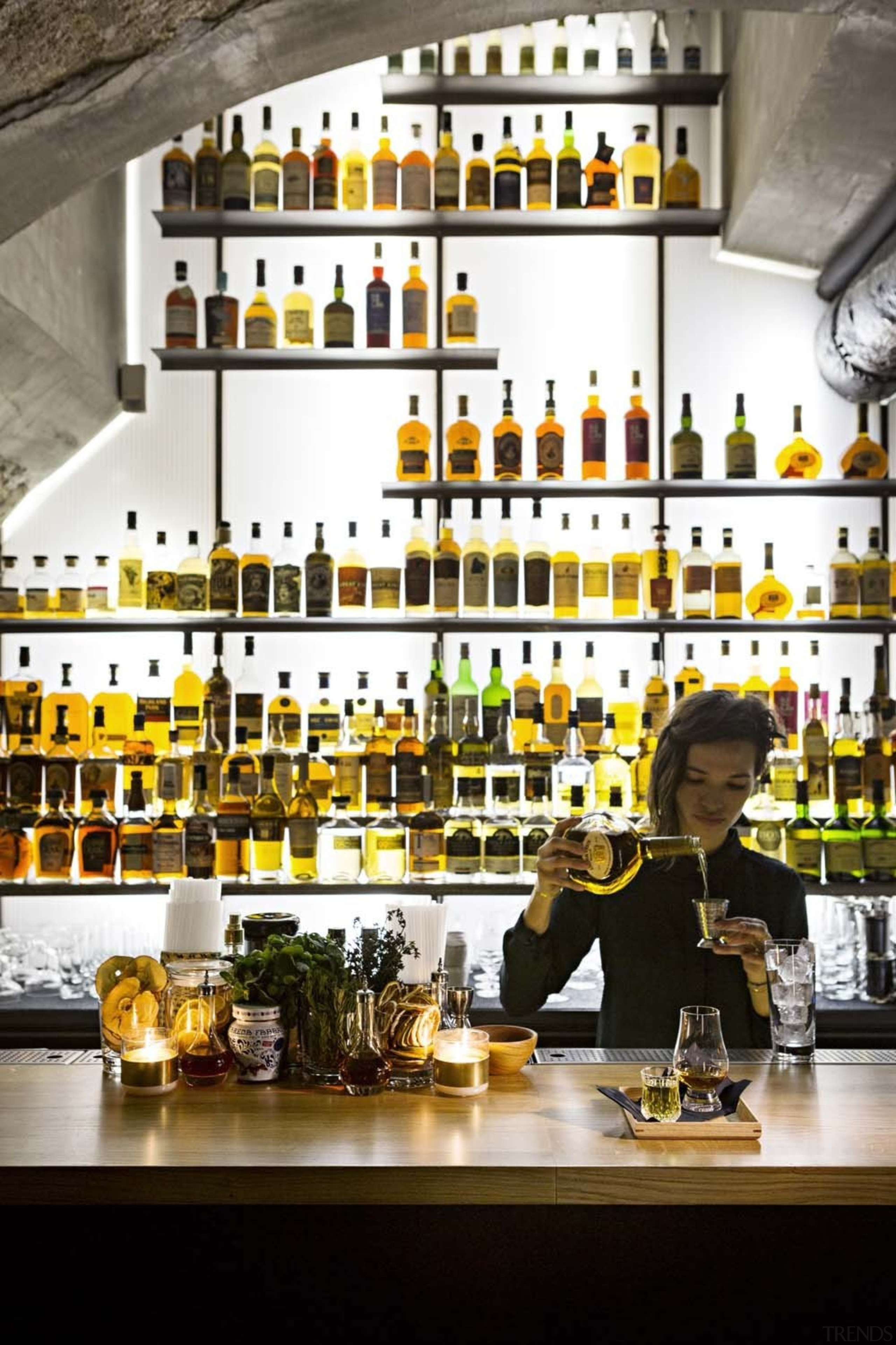 This new whiskey bar takes advantage of a bar, distilled beverage, drink, liquor store, white, black