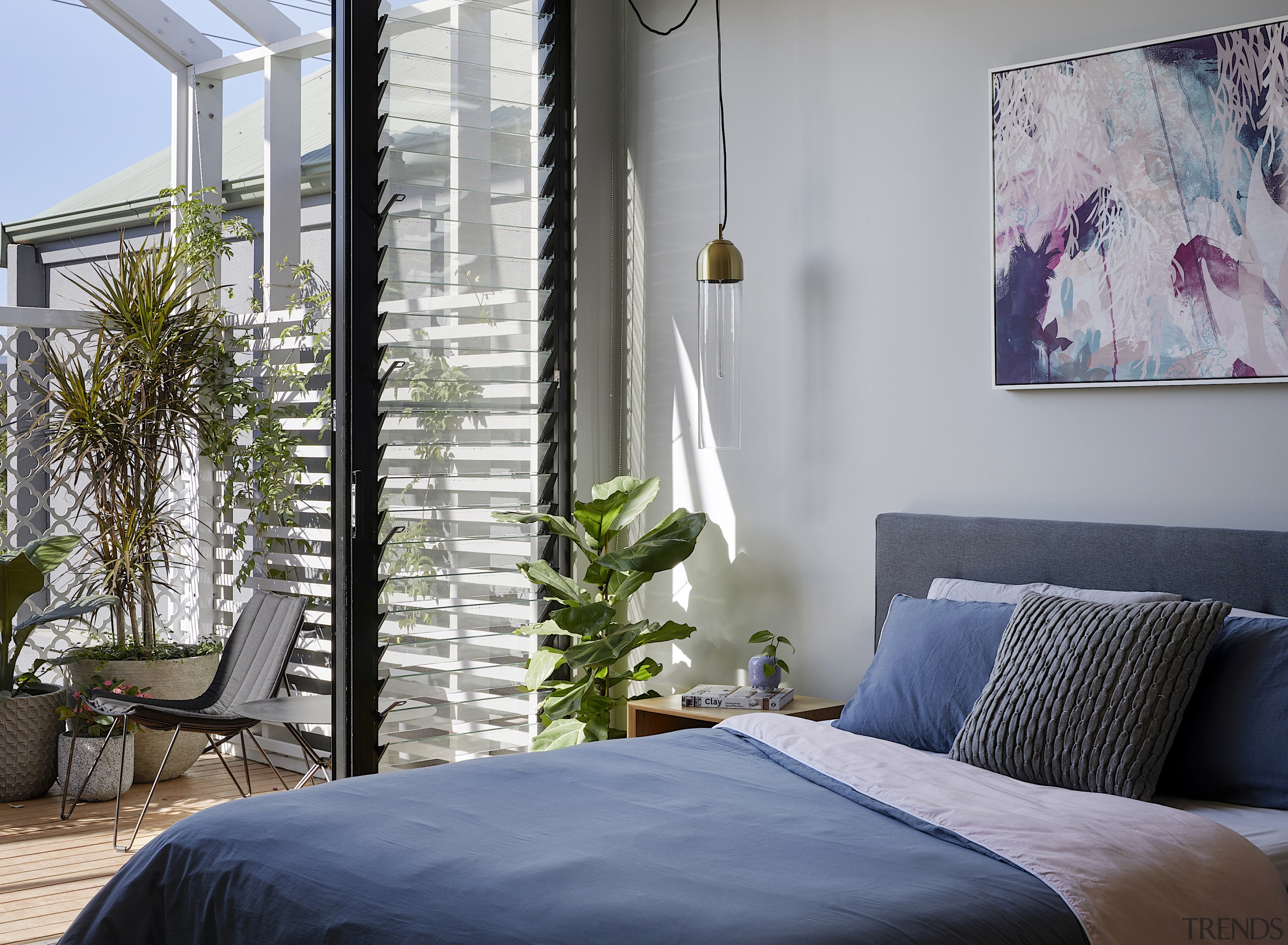 The main bedroom opens onto a balcony with 