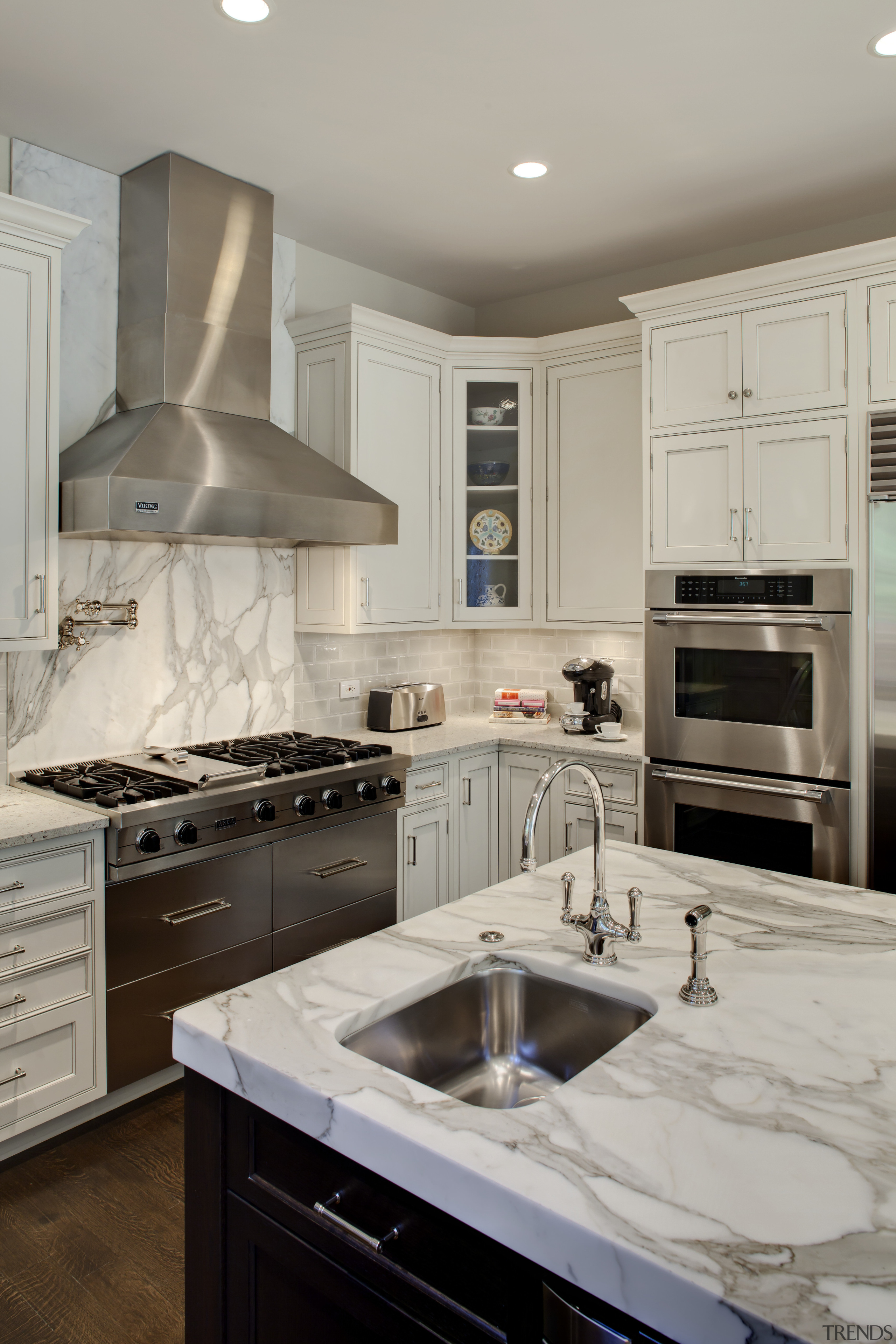 View of kitchen with wooden flooring, stainless drawers cabinetry, countertop, cuisine classique, floor, home, home appliance, interior design, kitchen, kitchen appliance, room, gray