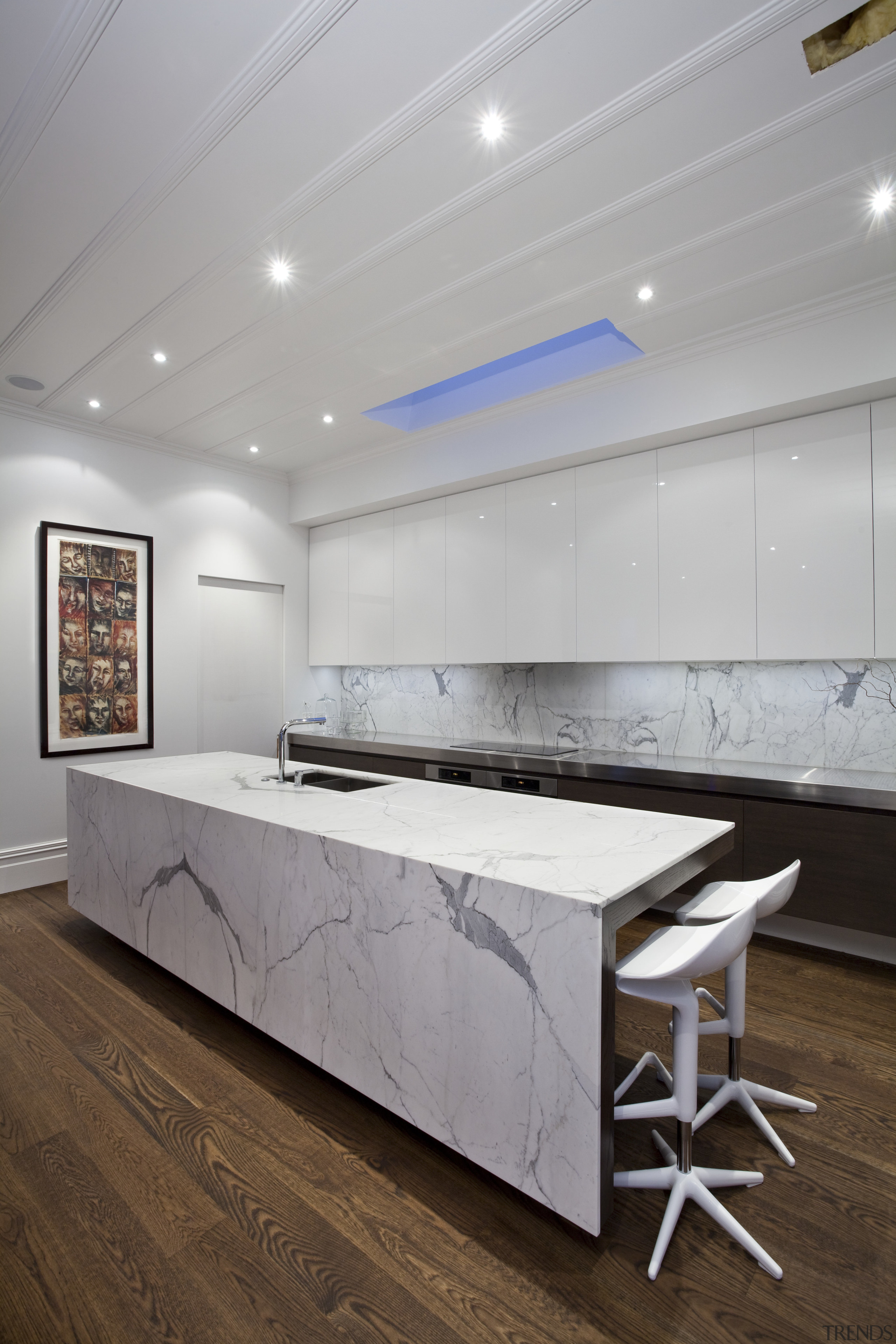 Designed by Morgan Cronin of Cronin Kitchens, this architecture, ceiling, floor, flooring, furniture, interior design, product design, table, wall, gray