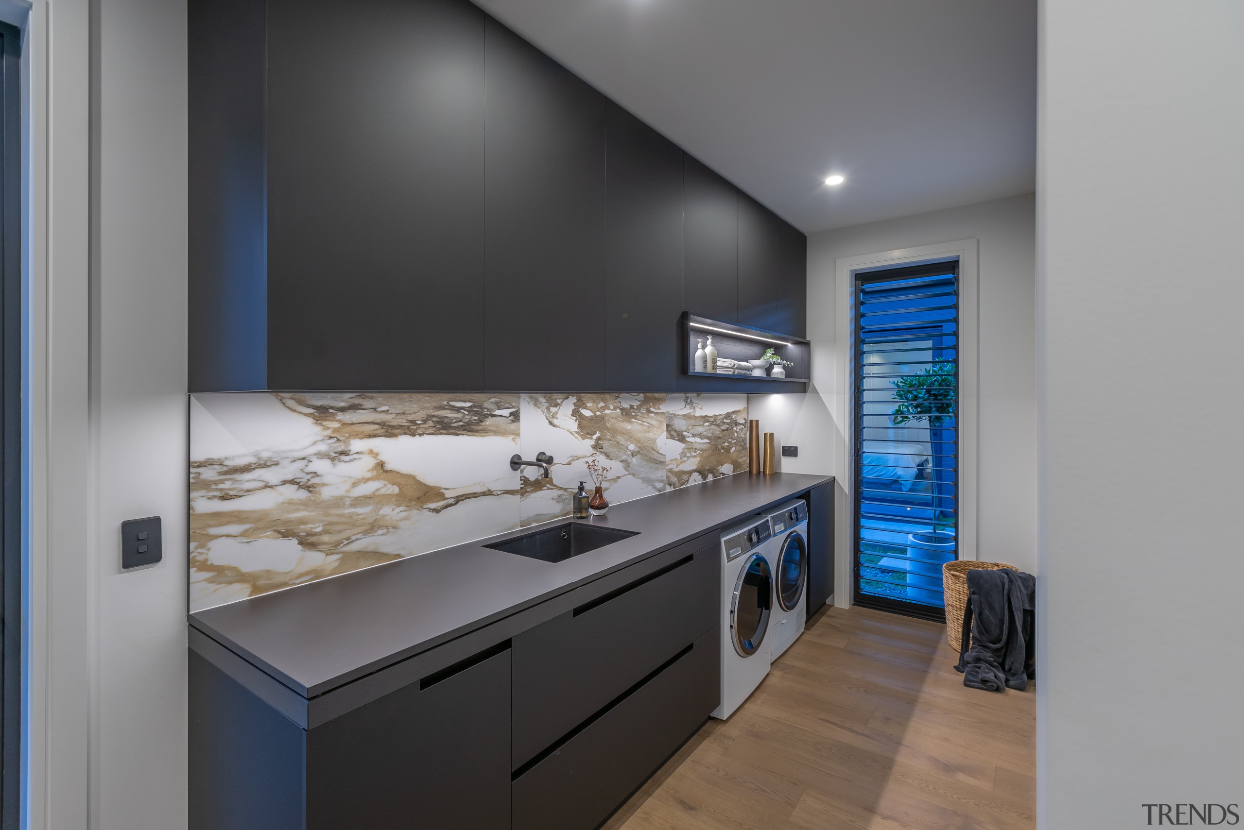 Dedicated laundry with upmarket splashback. 