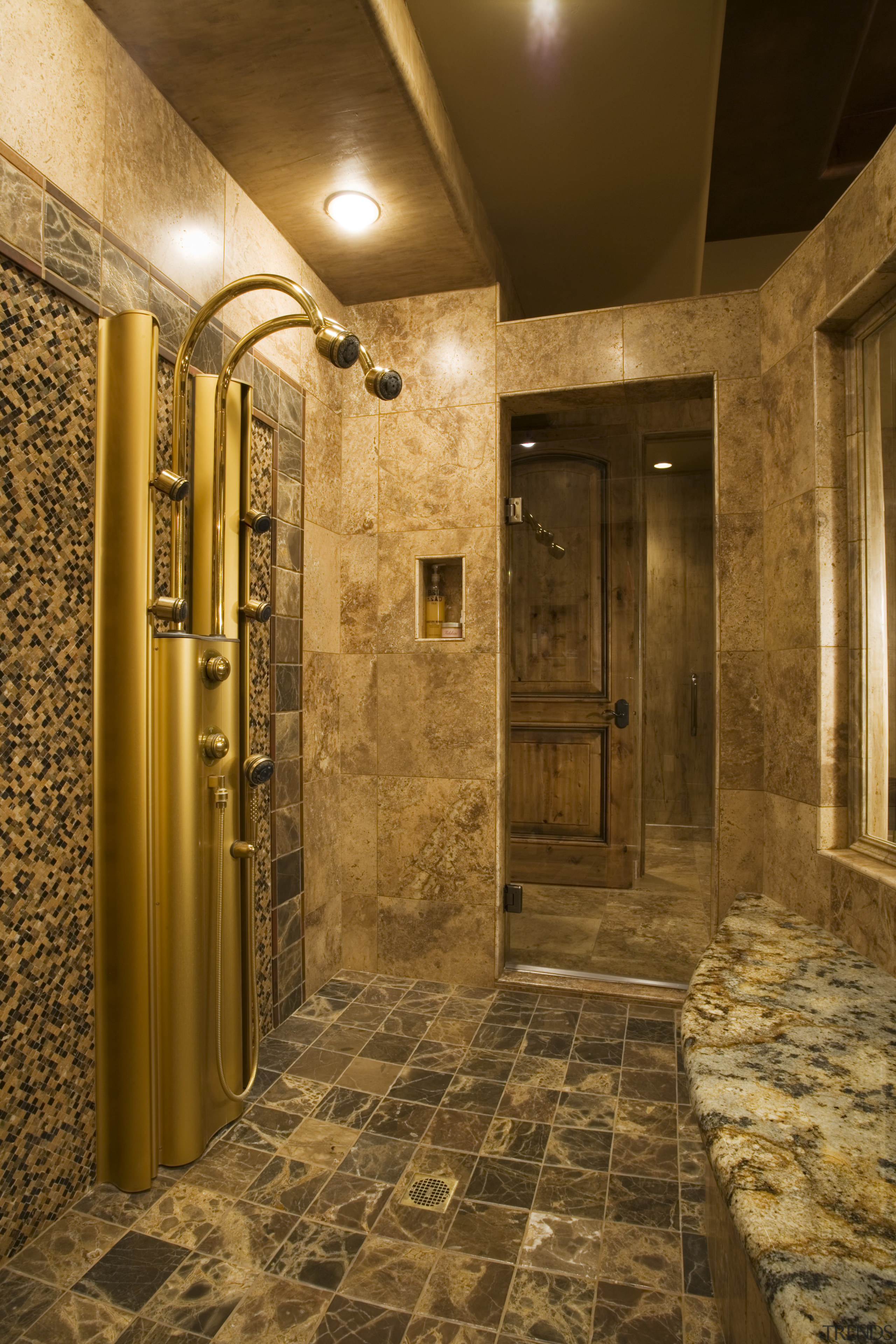 A view of this bathroom featuring gold wave bathroom, ceiling, floor, flooring, interior design, lighting, lobby, room, wall, brown
