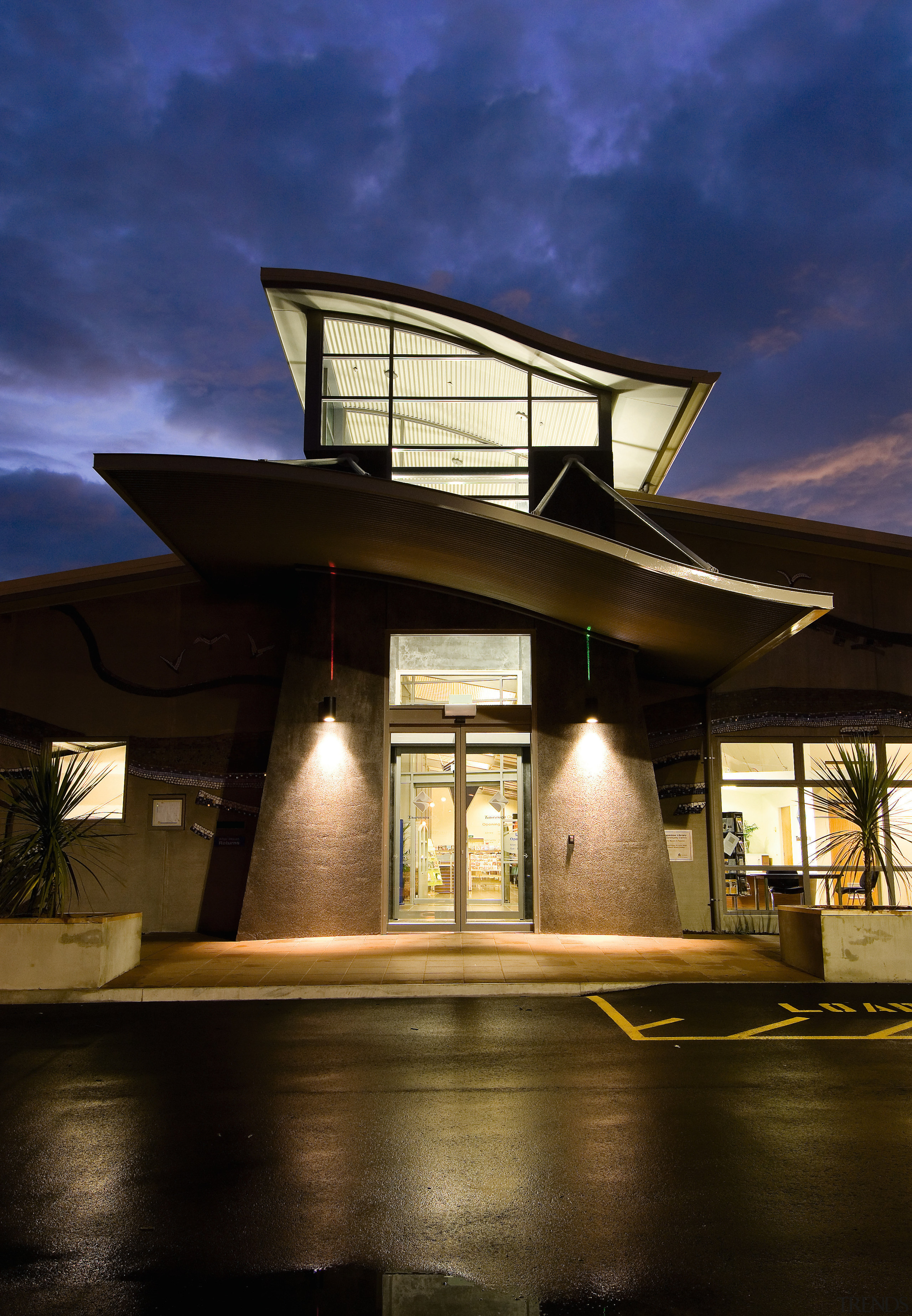 A view of the Papamoa Library constructed by architecture, building, evening, home, house, lighting, reflection, sky, brown, blue