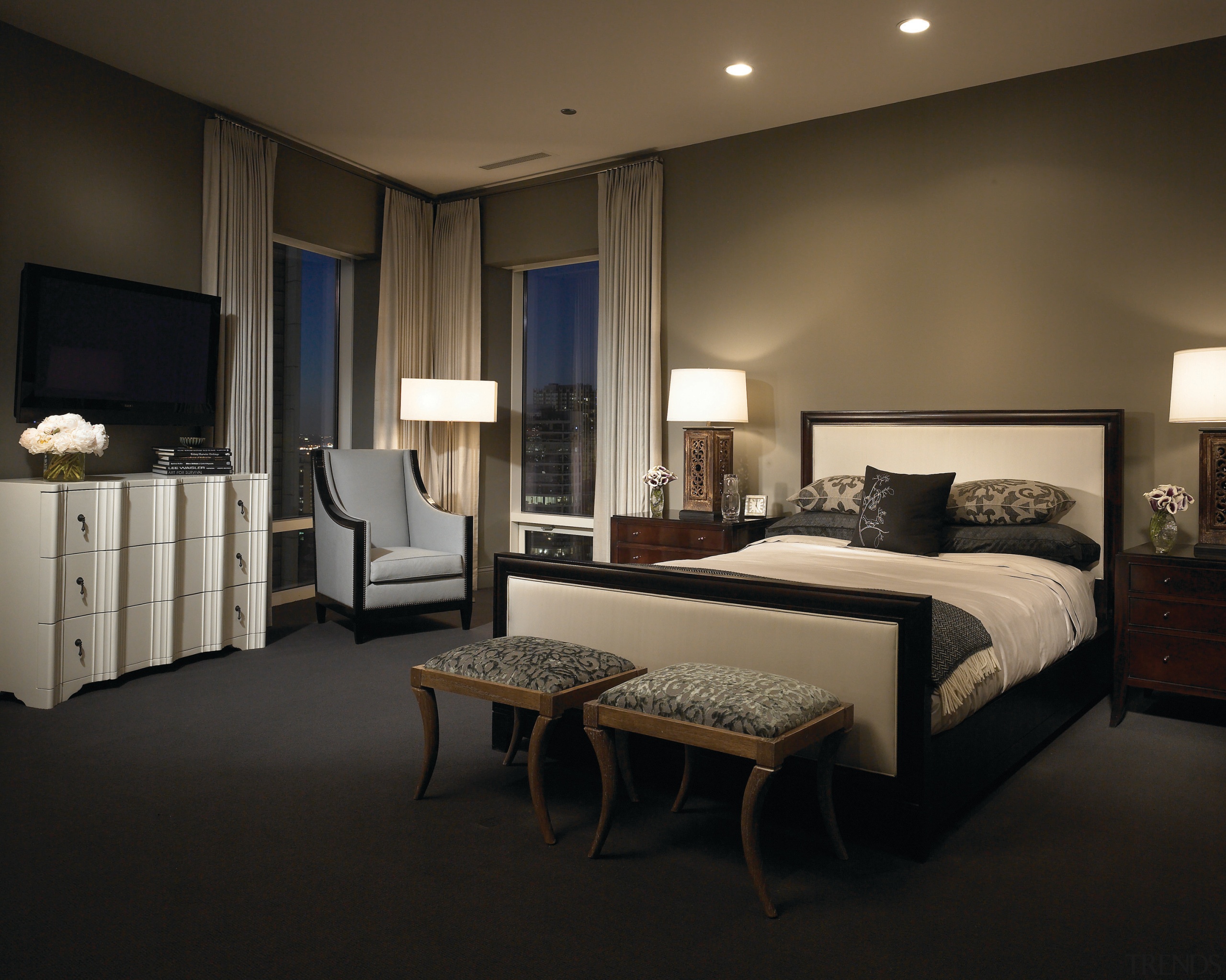 This master suite was designed by the Gary bed frame, bedroom, ceiling, floor, furniture, interior design, lighting, room, suite, wall, window, black