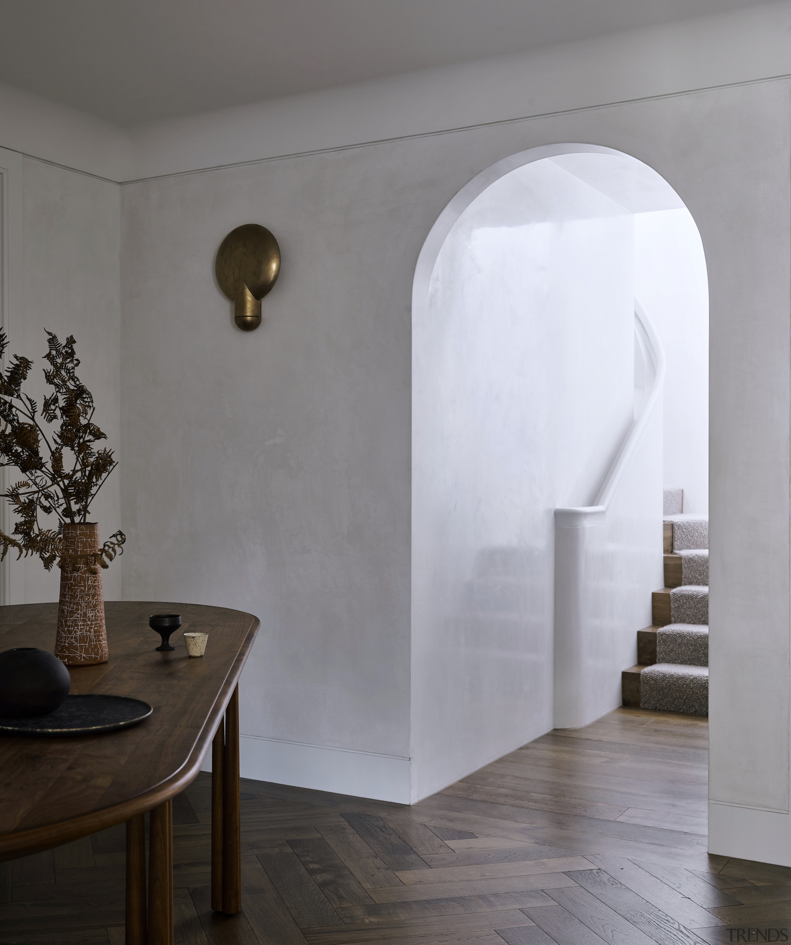 Carpeted timber stairs lead up to the master 