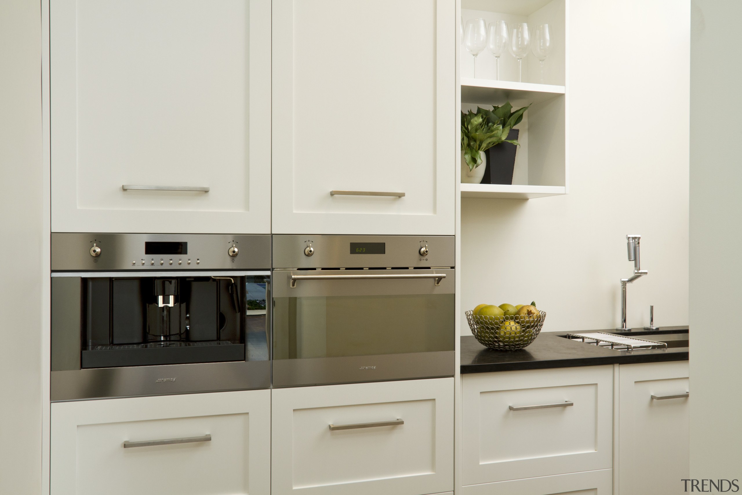 View of kitchen with wooden flooring, dark benchtops cabinetry, countertop, cuisine classique, home appliance, kitchen, kitchen appliance, major appliance, room, white