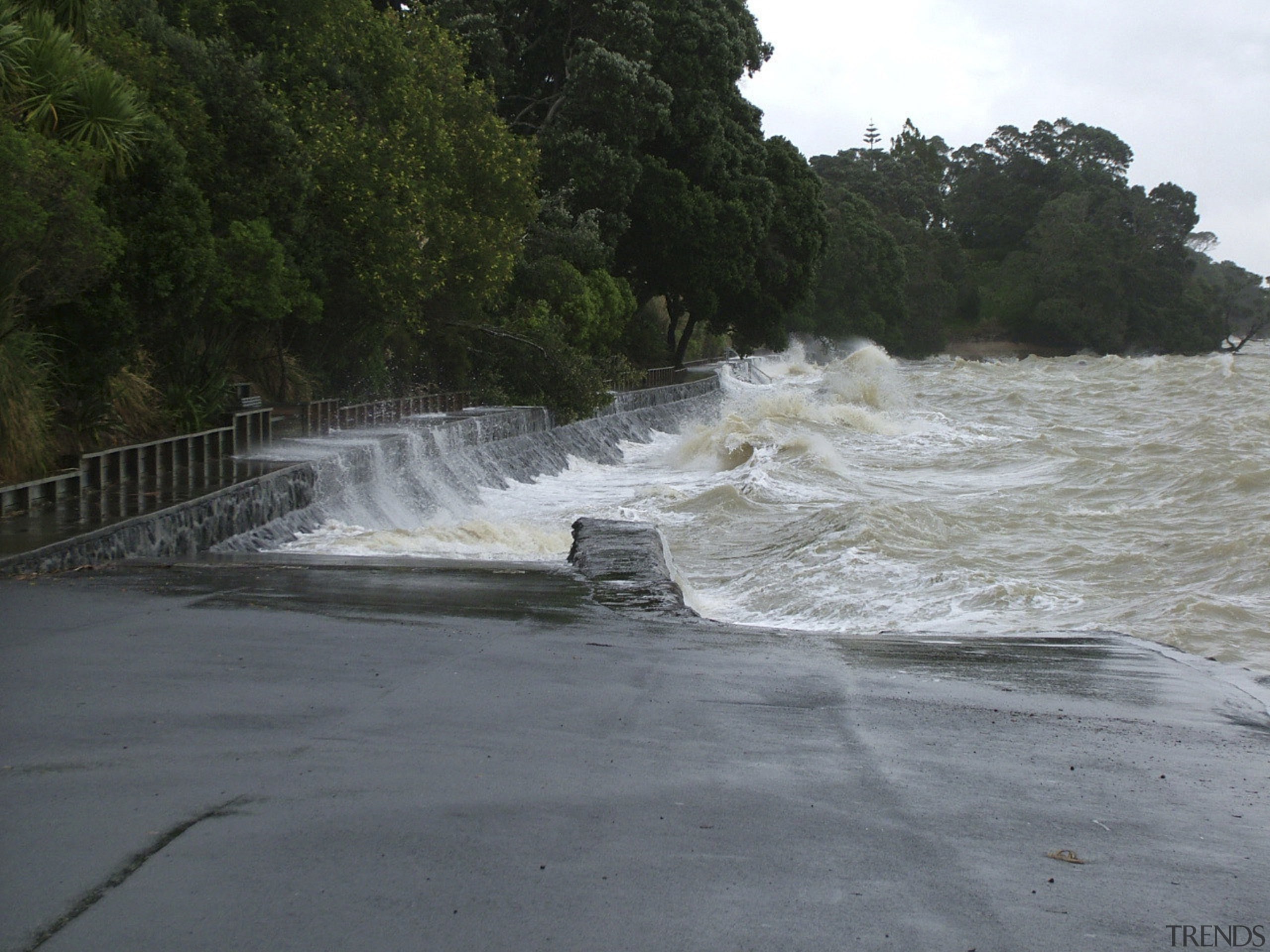 Shot of the seawall battling a storm. - body of water, coast, coastal and oceanic landforms, rapid, river, sea, shore, tree, water, water feature, water resources, watercourse, wave, wind wave, gray