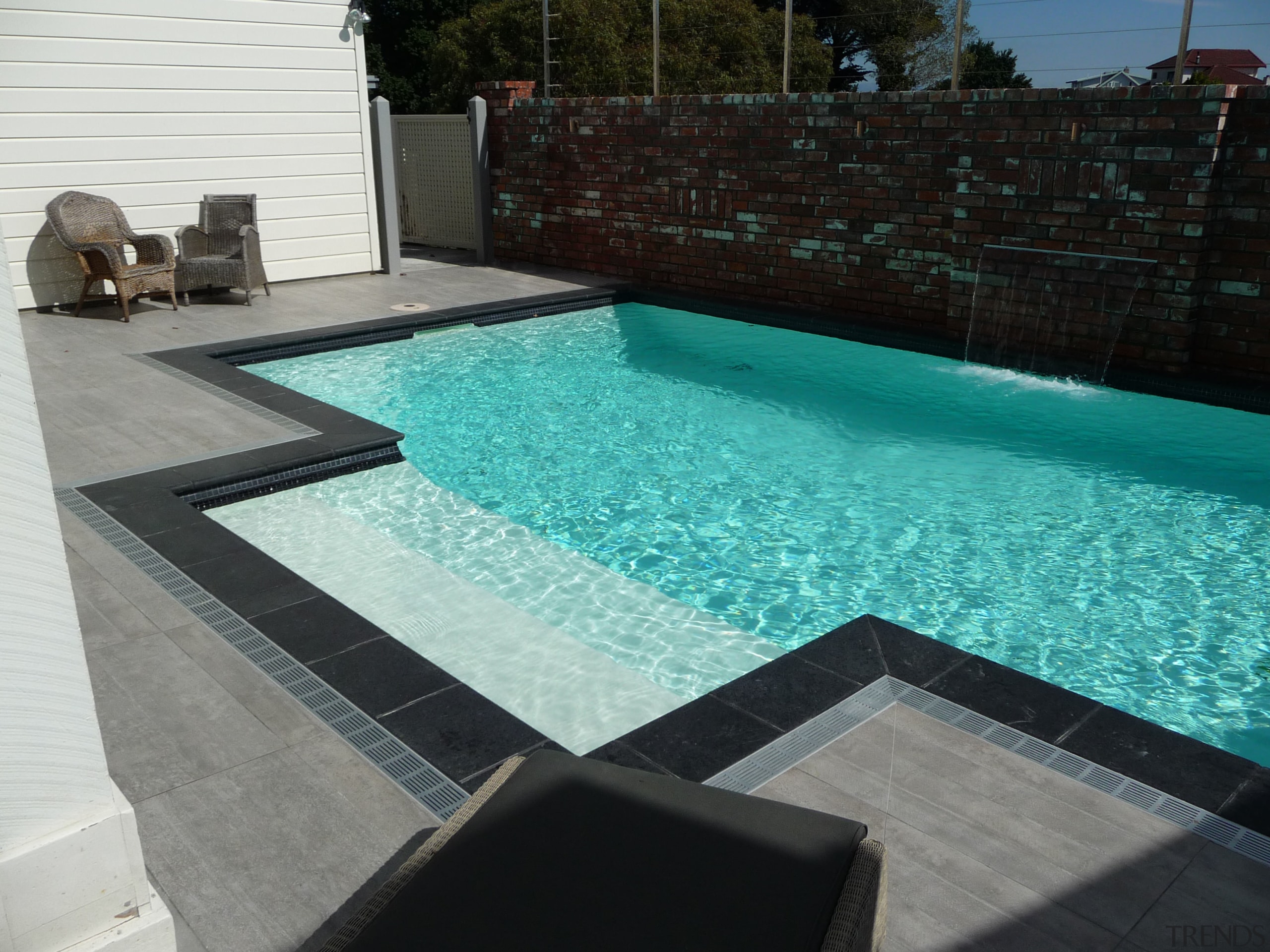 Above: This sparkling Mayfair pool in the evocative floor, leisure, property, swimming pool, water, water feature, wood, black