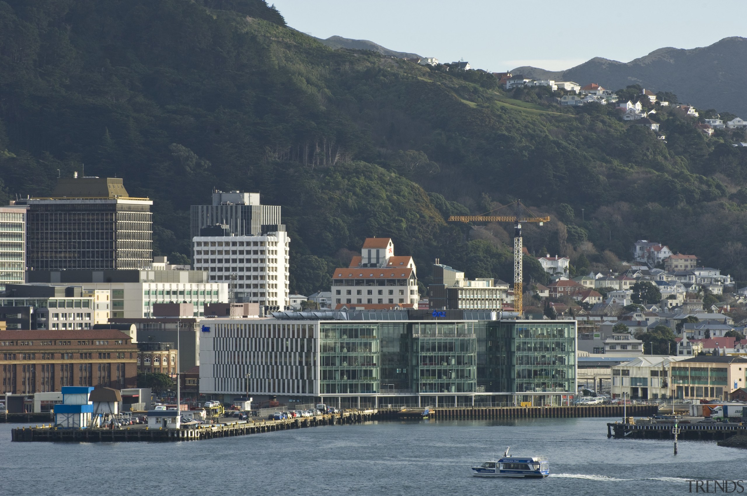 View of the new BNZ Building in Wellington bay, city, cityscape, coast, daytime, downtown, harbor, lake, marina, metropolis, metropolitan area, mountain, port, river, sea, sky, skyline, skyscraper, tower block, town, urban area, water, black, gray