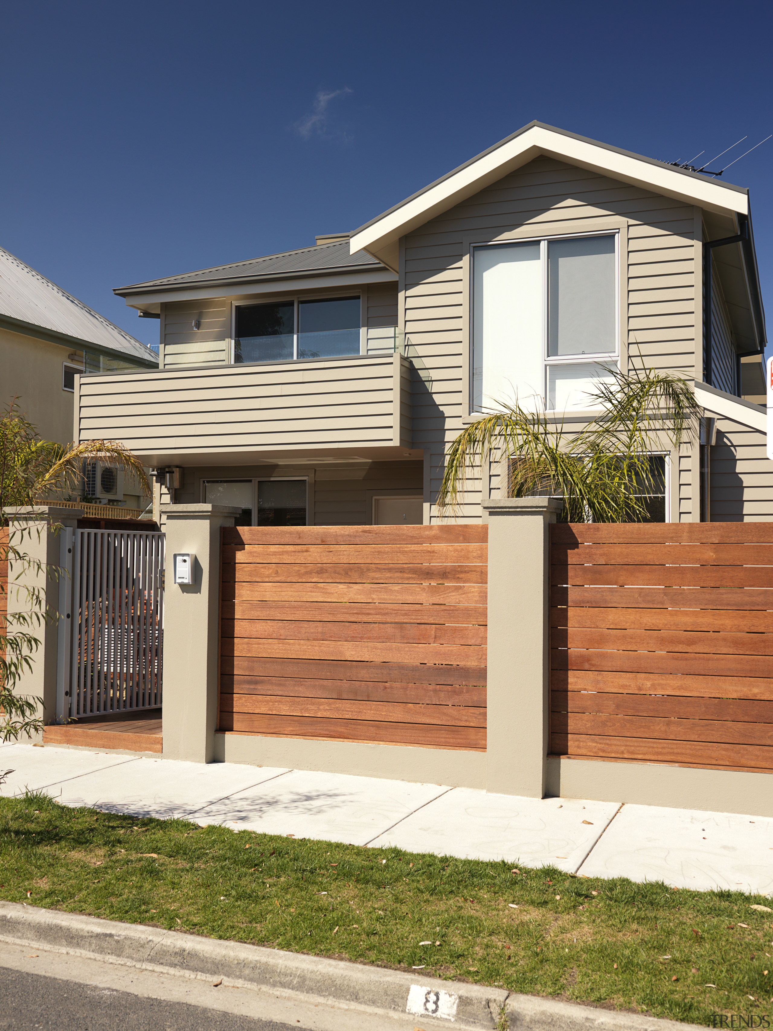 An exterior view of this house featuring Jame building, elevation, facade, fence, gate, home, home fencing, house, neighbourhood, property, real estate, residential area, siding, suburb, orange