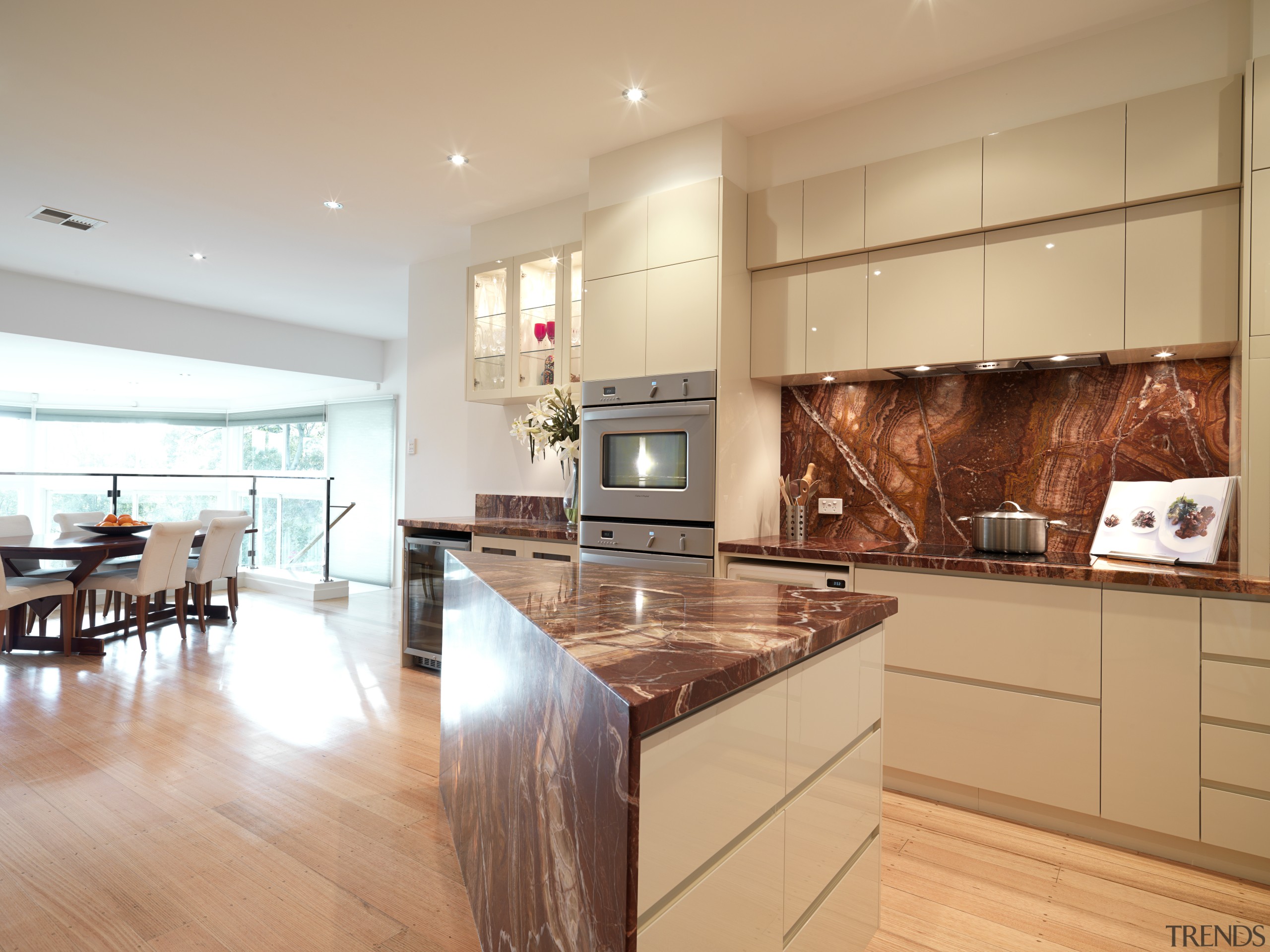 View of contemporary kitchen with light wooden flooring, cabinetry, countertop, floor, flooring, hardwood, interior design, kitchen, real estate, wood flooring, orange, white