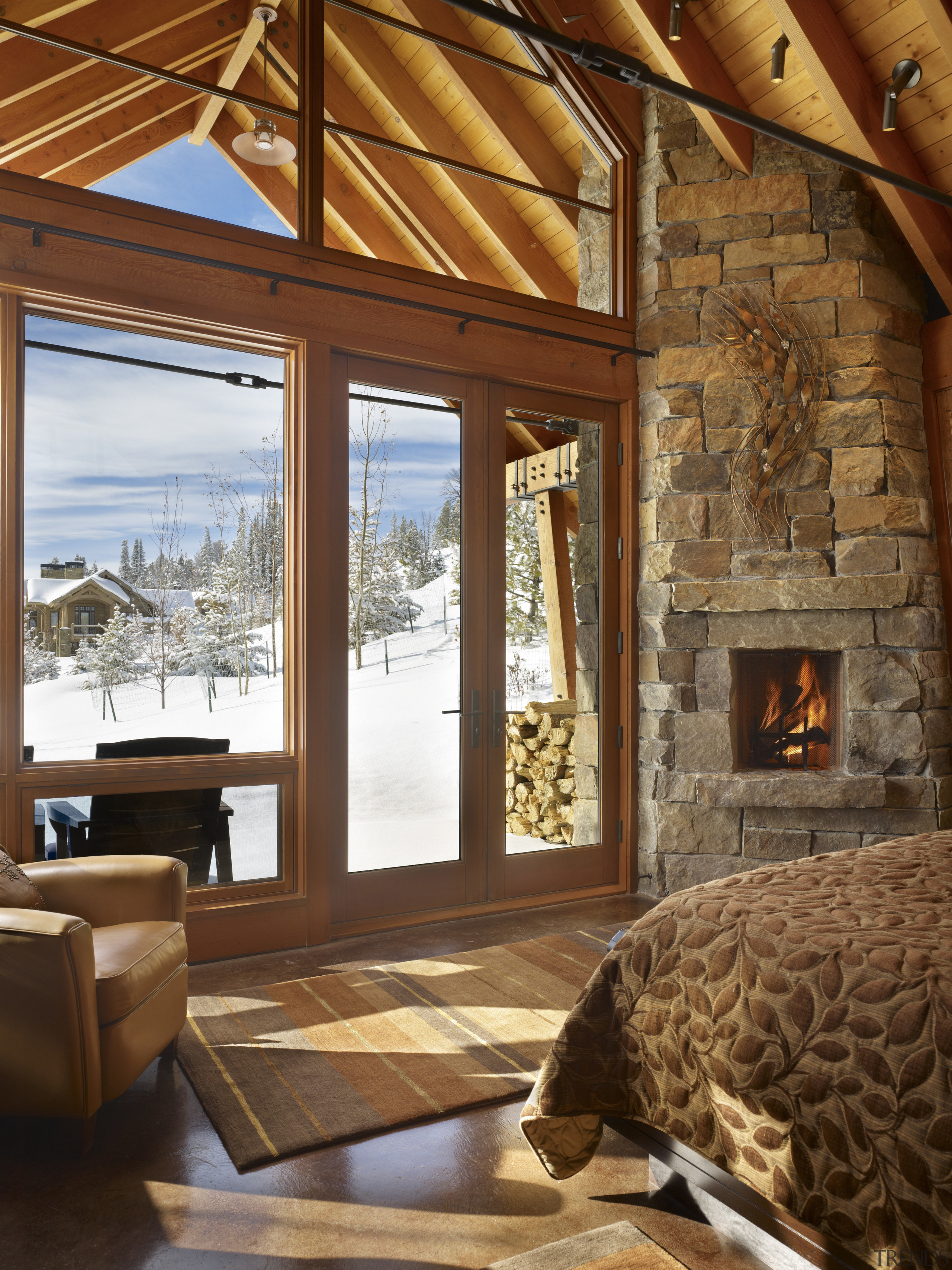 The master bedroom of this mountain house has ceiling, home, interior design, living room, real estate, room, window, wood, brown