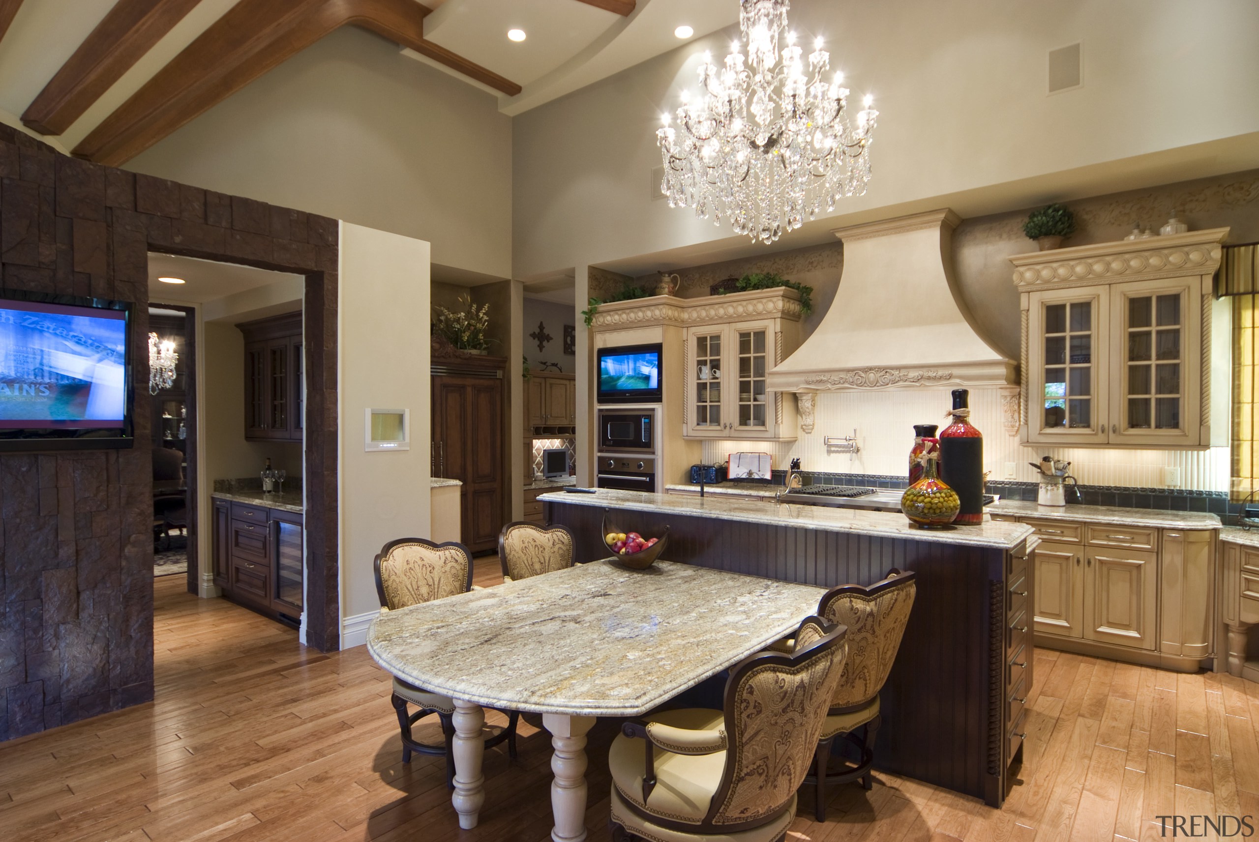 The kitchen features furniture-style cabinets in two designs. ceiling, countertop, cuisine classique, estate, interior design, kitchen, living room, real estate, room, brown, orange